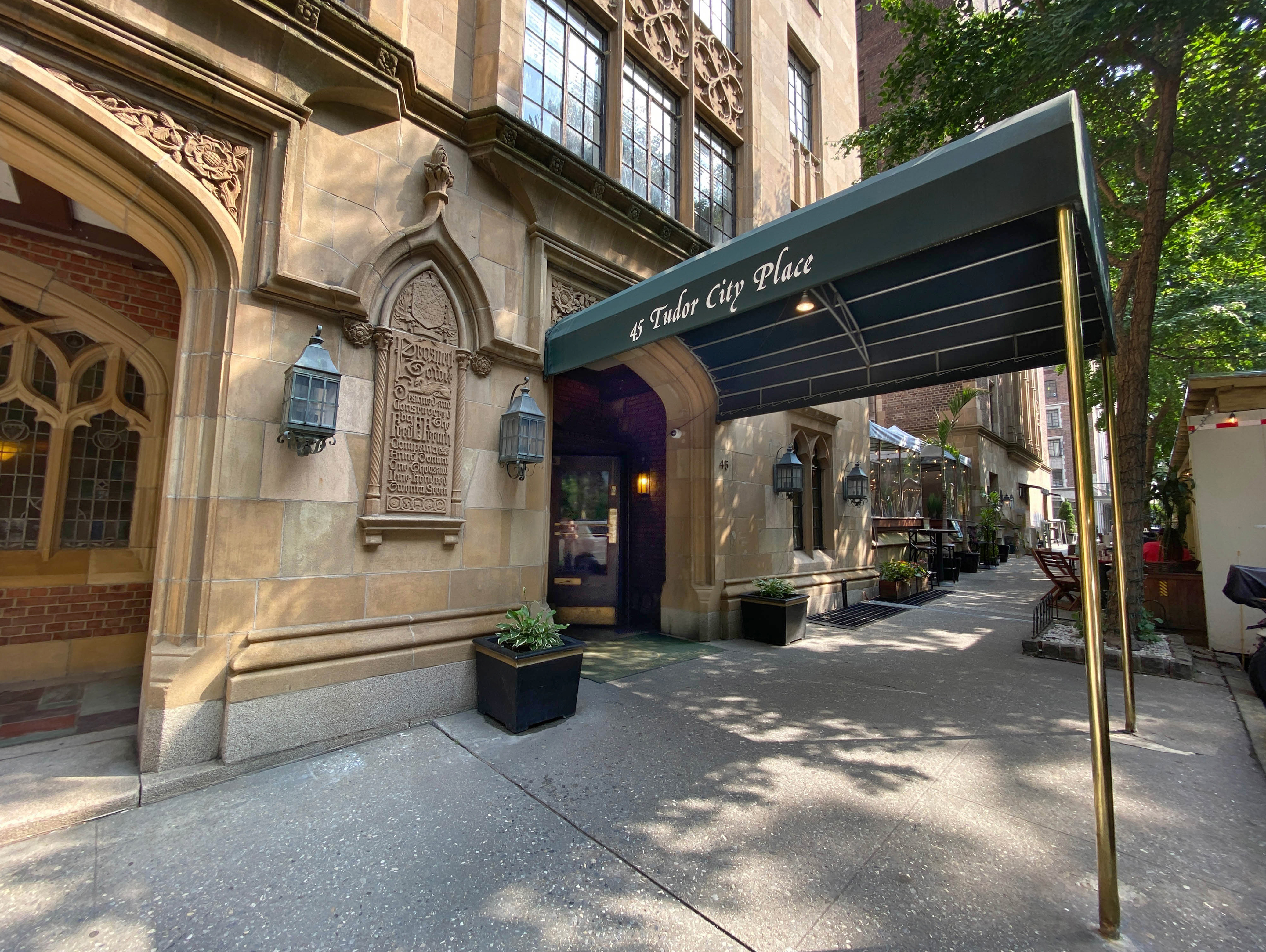 45 Tudor City Place, Unit 1708 Manhattan, NY 10017 - Photo 8 of 14 a view of a building with car parked