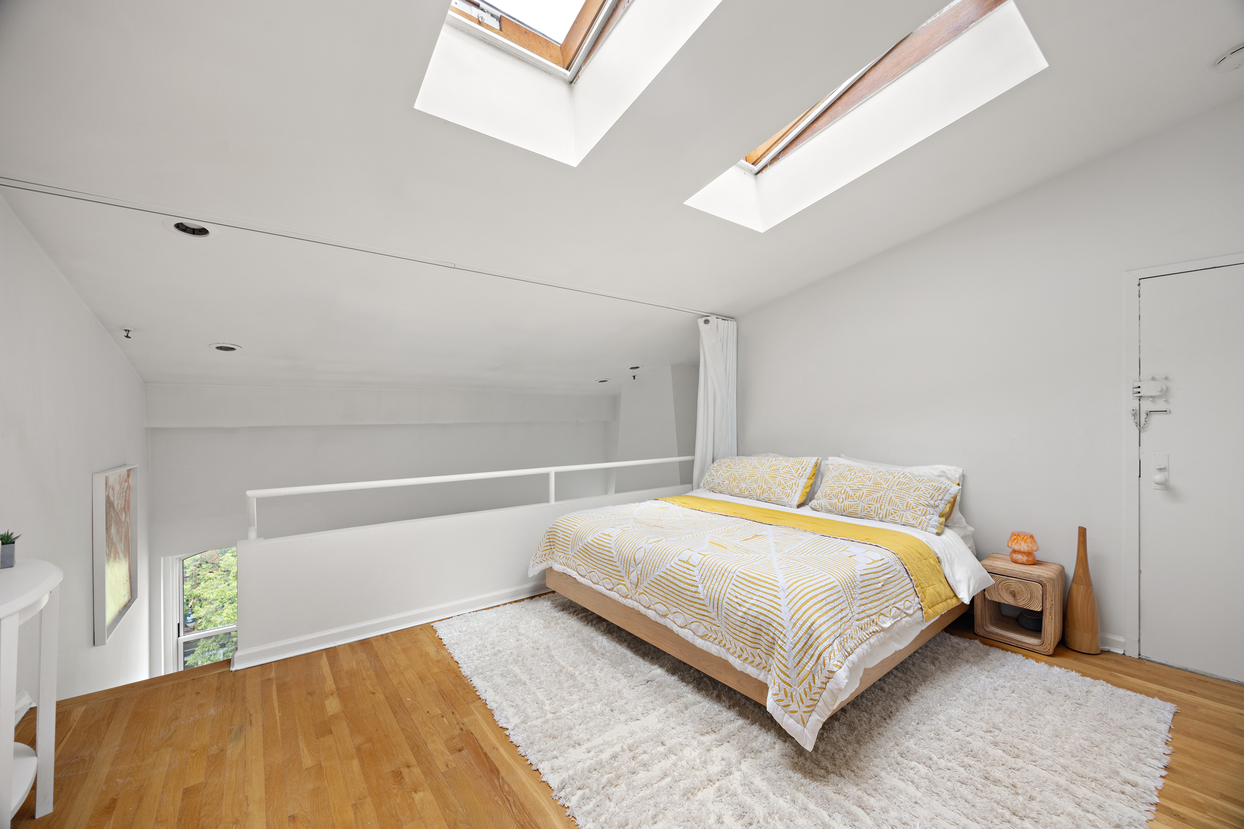 124 Atlantic Avenue, Unit A4H Brooklyn, NY 11201 - Photo 15 of 19 a bedroom with a bed and a window