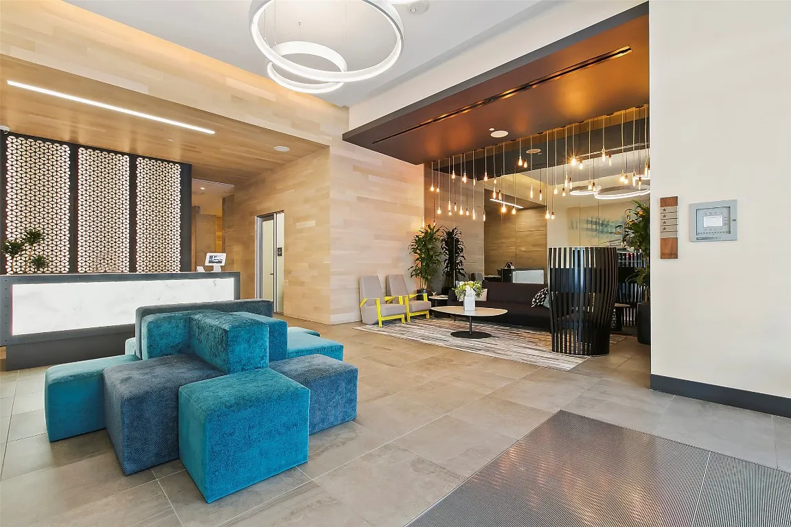 a living room with furniture a dining table and chairs