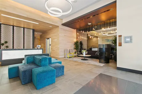 a living room with furniture a dining table and chairs