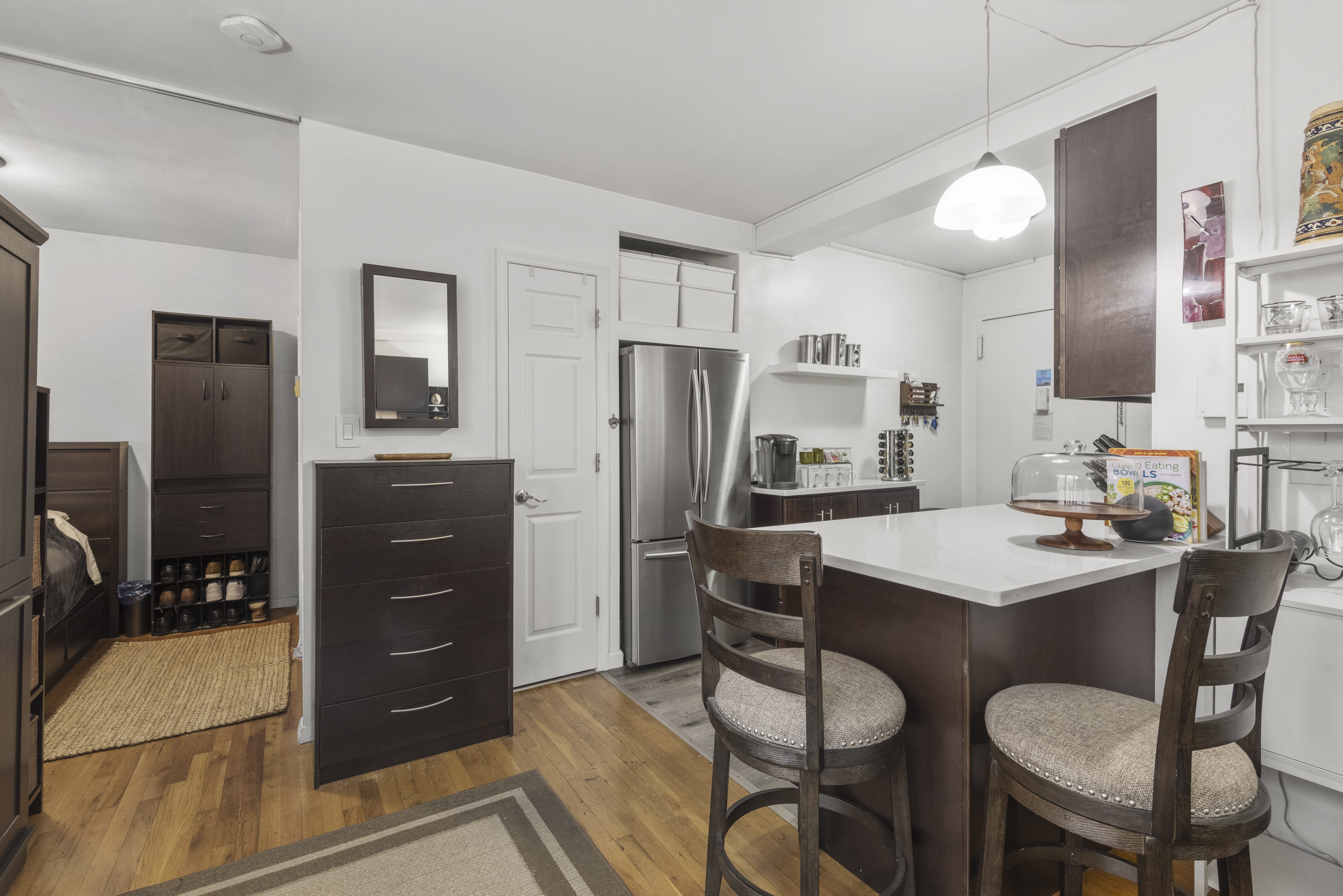 45 Overlook Terrace, Unit 7J Manhattan, NY 10033 - Photo 4 of 11 a kitchen with a refrigerator and a stove top oven