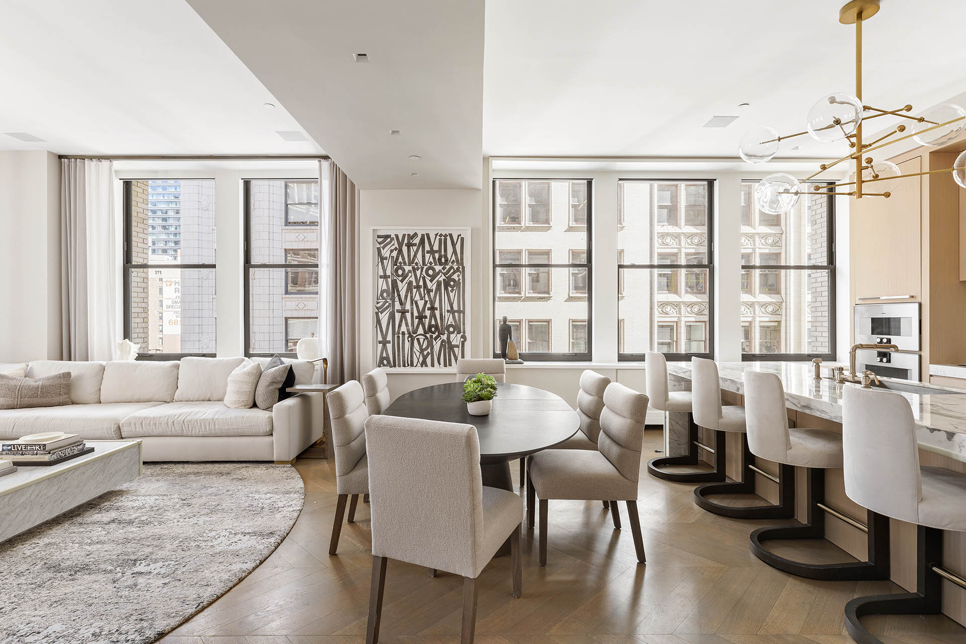 212 5th Avenue, Unit 9B Manhattan, NY 10010 - Photo 5 of 16 a living room with furniture and large windows