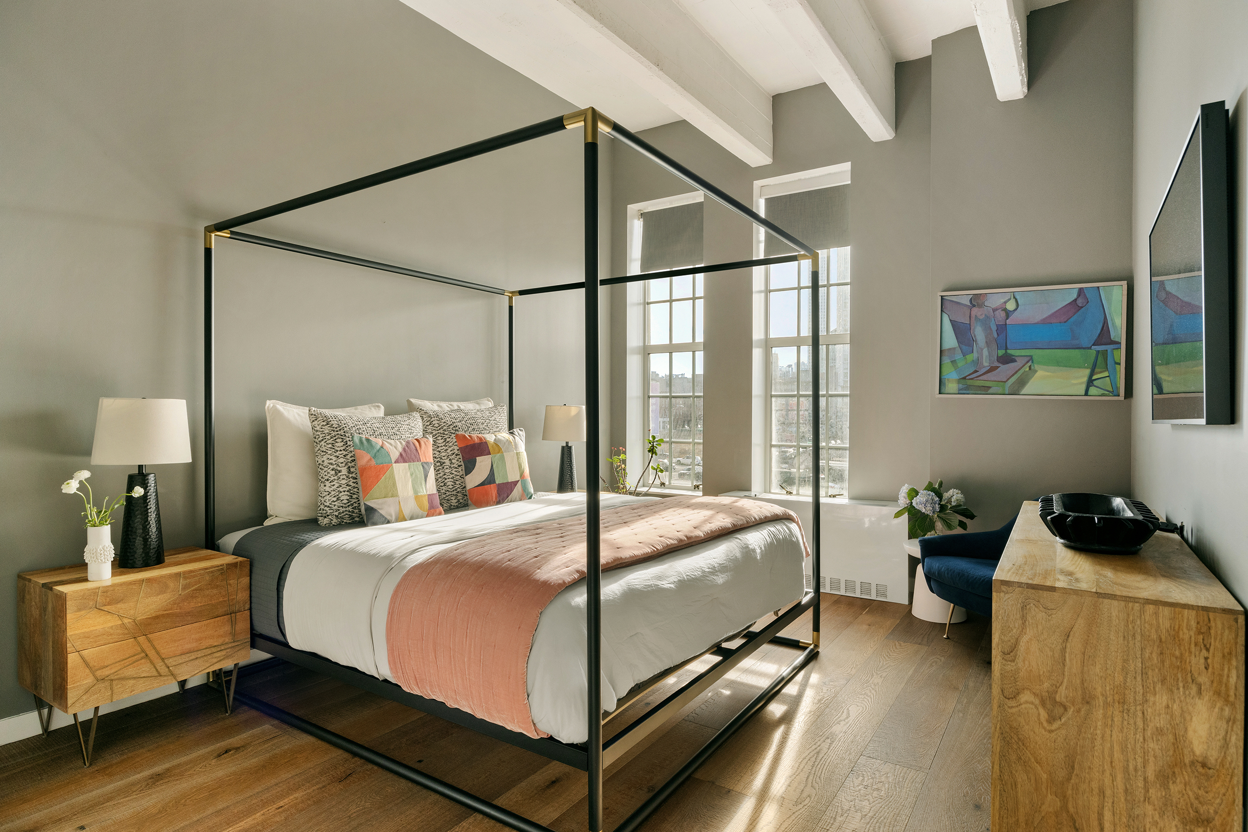 184 Kent Avenue, Unit B305 Brooklyn, NY 11249 - Photo 3 of 15 a bedroom with a bed and wooden floor