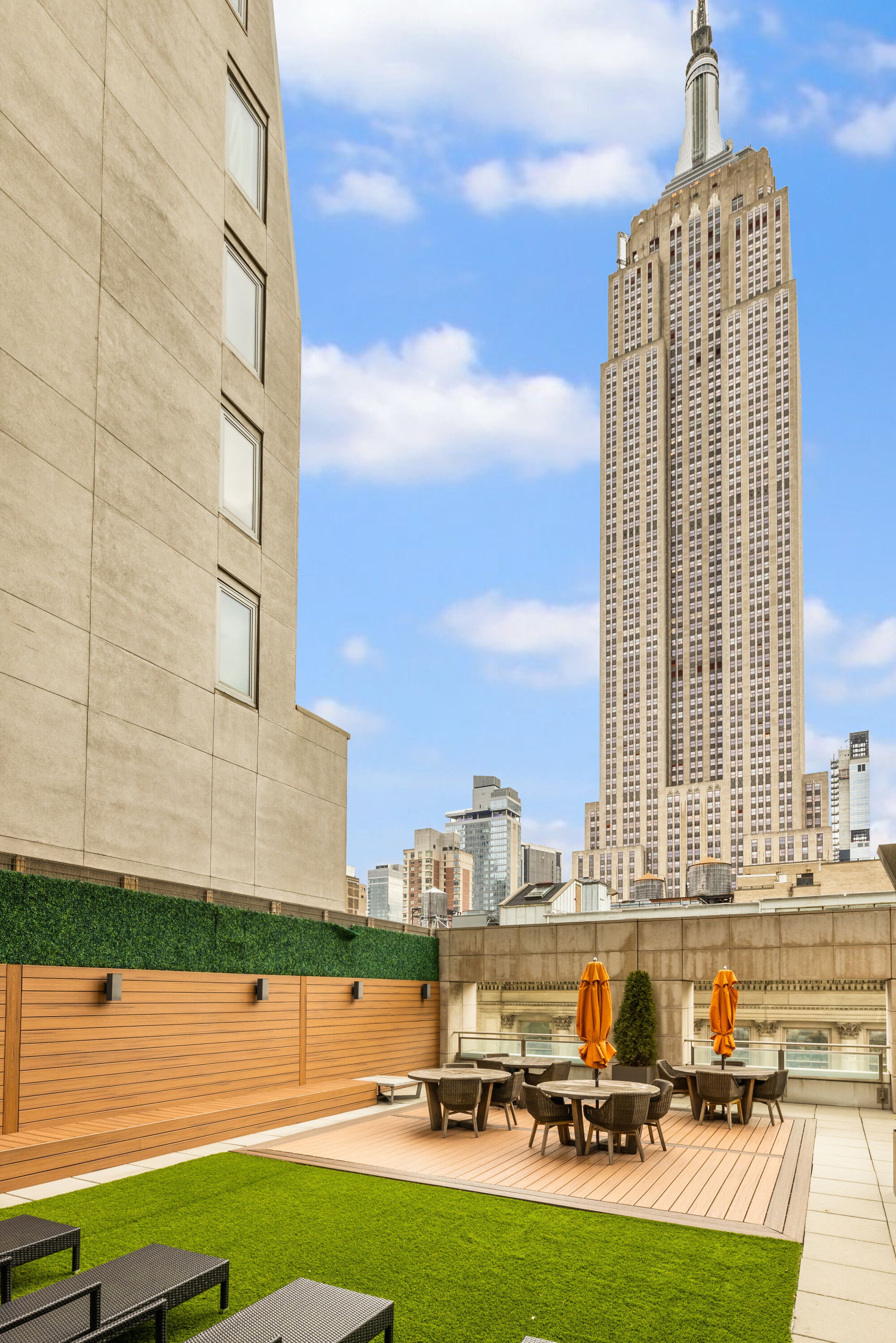400 5th Avenue, Unit 37C Manhattan, NY 10018 - Photo 12 of 19 a view of a swimming pool with outdoor seating and plants