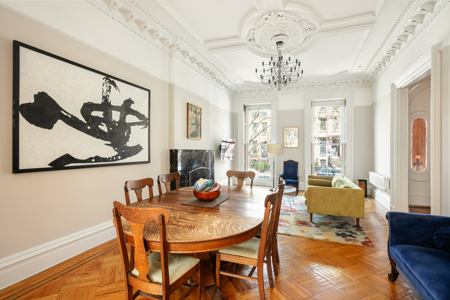 380 3rd Street, Unit PARLOR Brooklyn, NY 11215 - Photo 4 of 19 a view of a dining room with furniture a chandelier and wooden floor