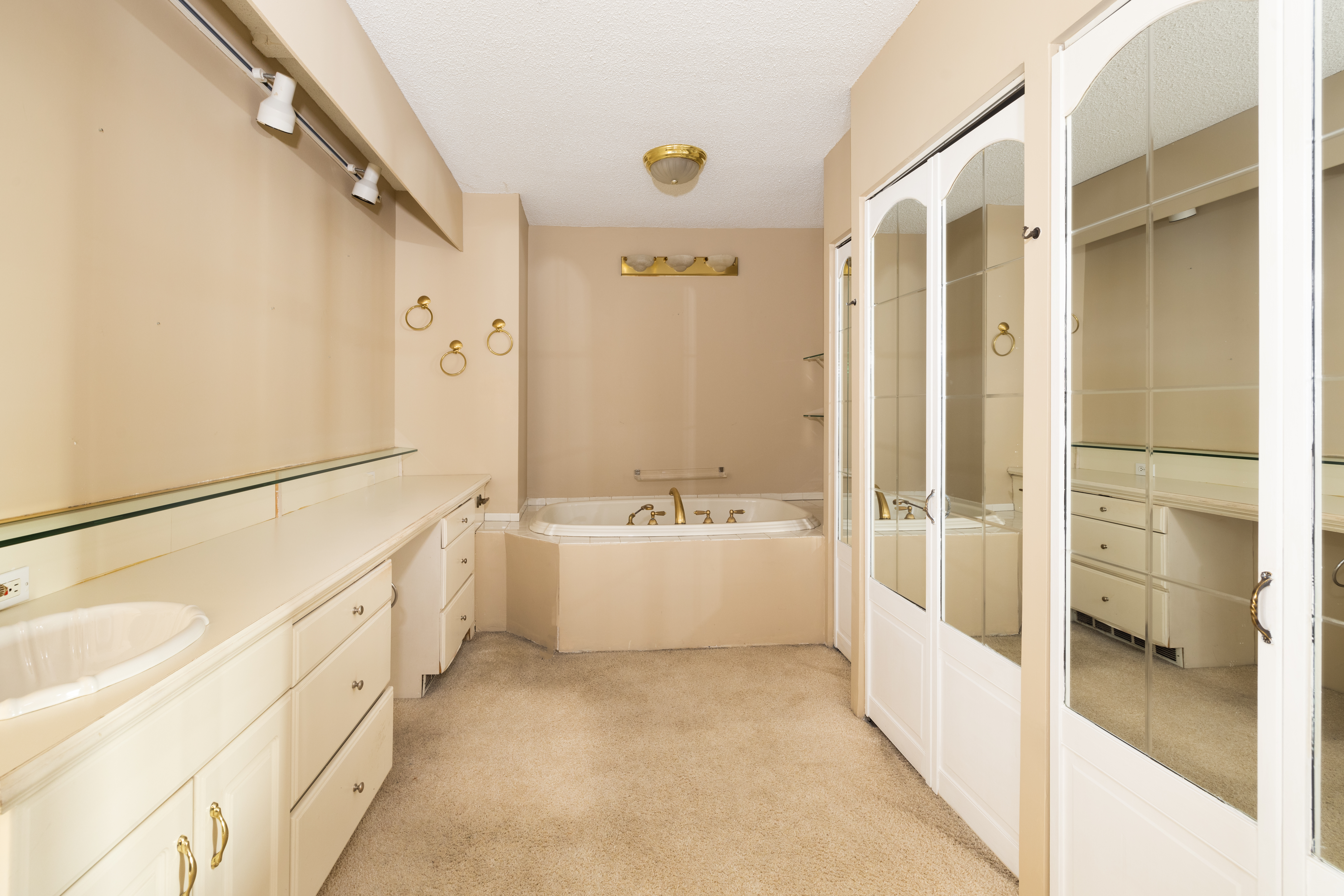 20 West 64th Street, Unit 41H Manhattan, NY 10023 - Photo 14 of 39 a bathroom with a bathtub and a shower