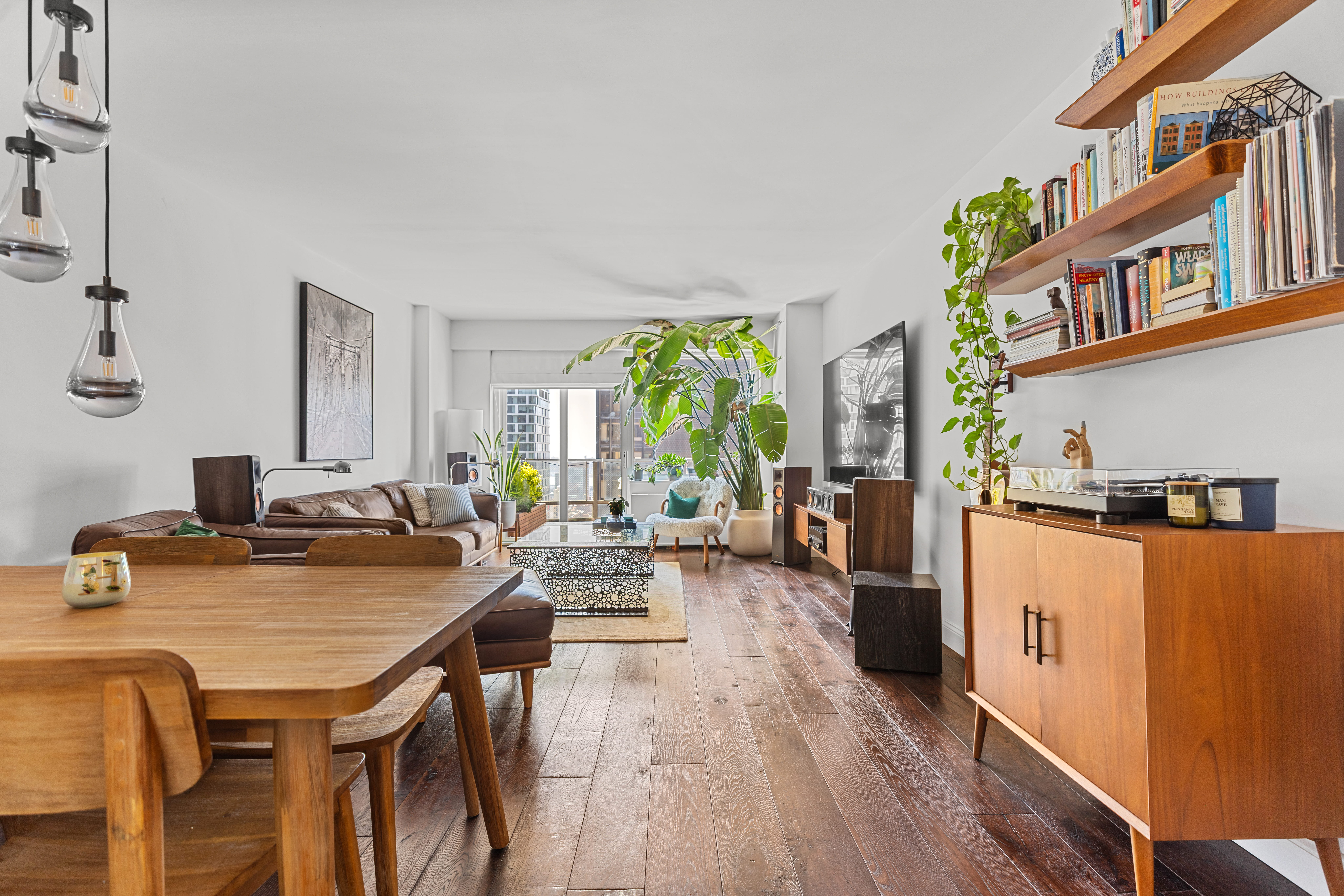159 West 53rd Street, Unit 31F Manhattan, NY 10019 - Photo 2 of 16 a view of a living room and dining room