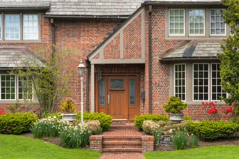 a front view of a house with garden