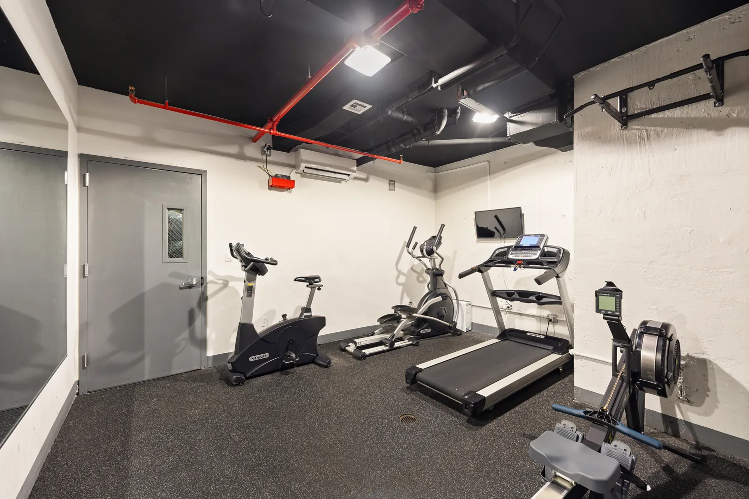 a view of a room with gym equipment