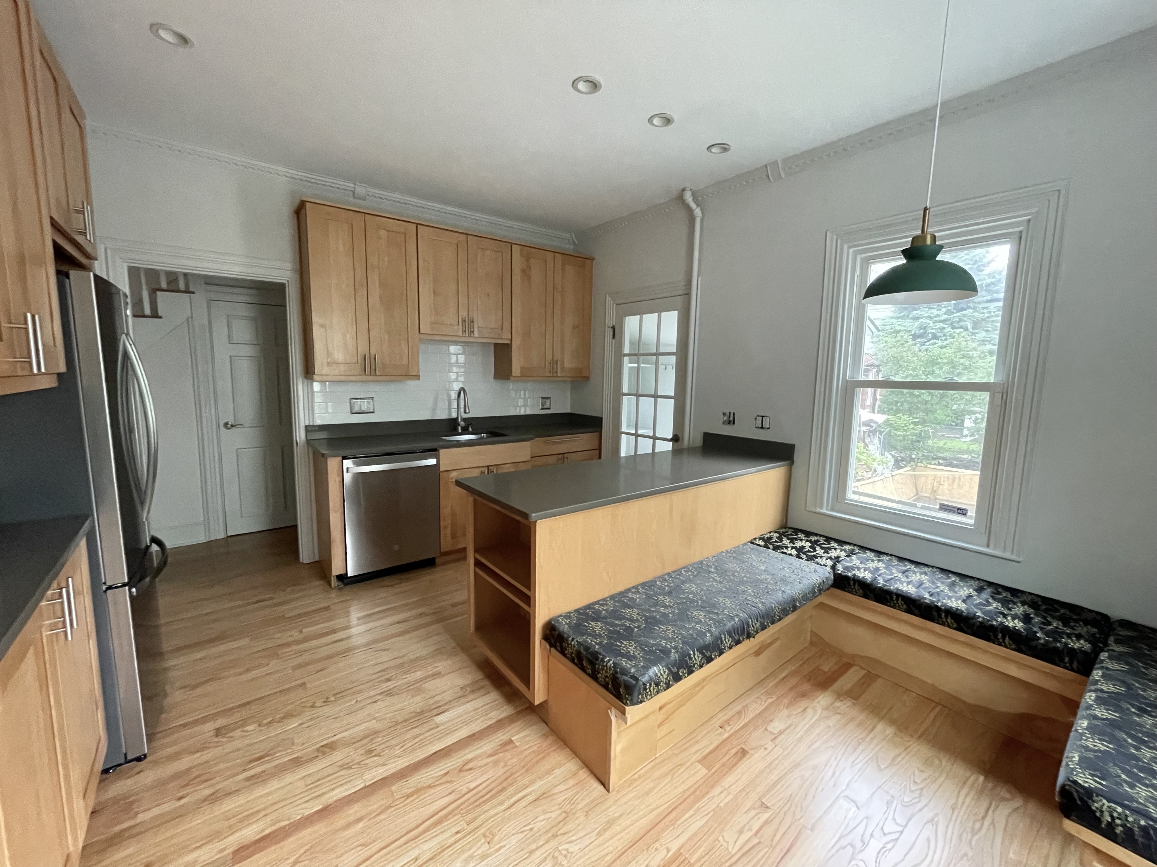 49 8th Street Cambridge, MA 02141 - Photo 1 of 6 a kitchen with stainless steel appliances granite countertop a stove a refrigerator and a sink