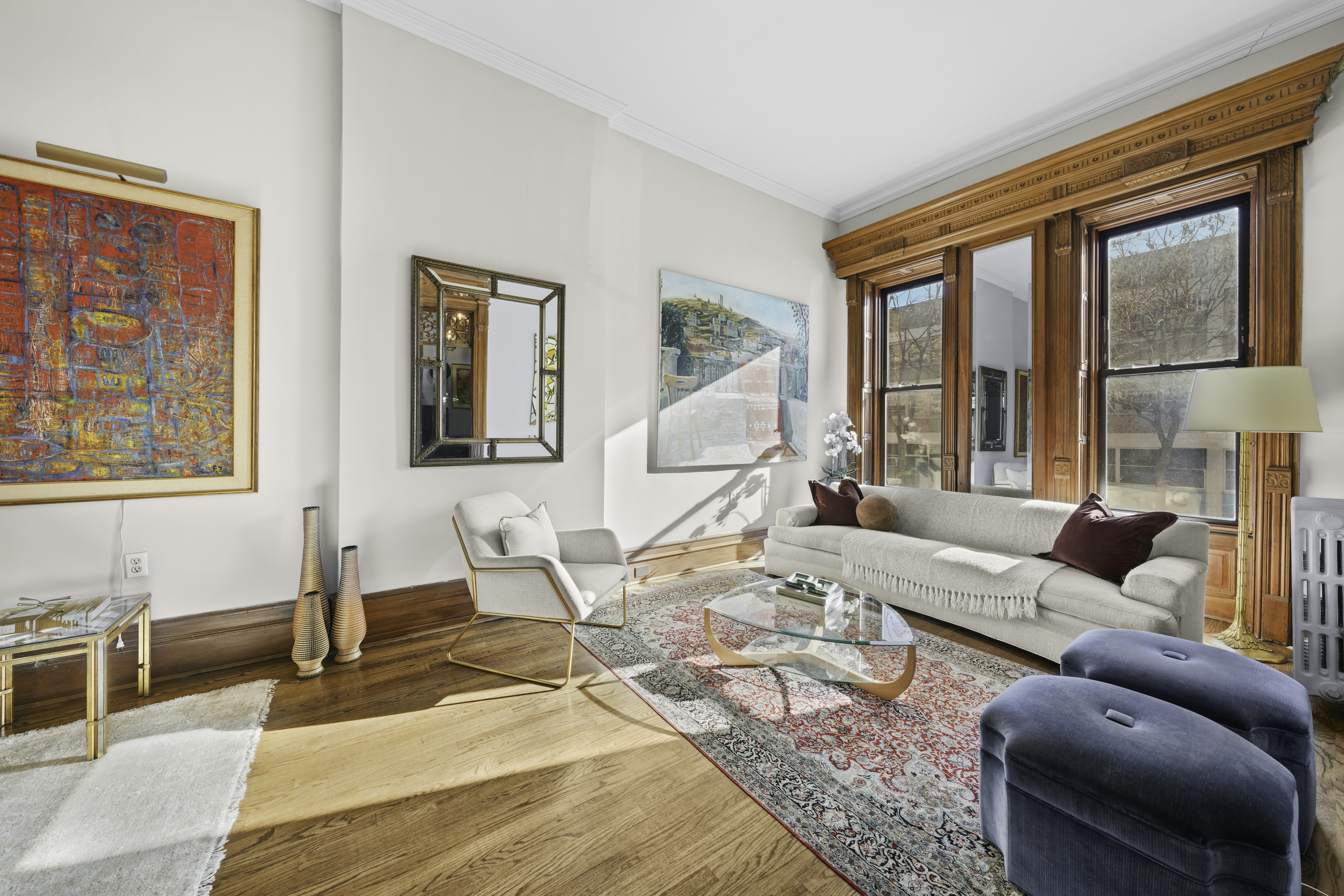 127 West 122nd Street Manhattan, NY 10027 - Photo 6 of 17 a living room with furniture and a large window