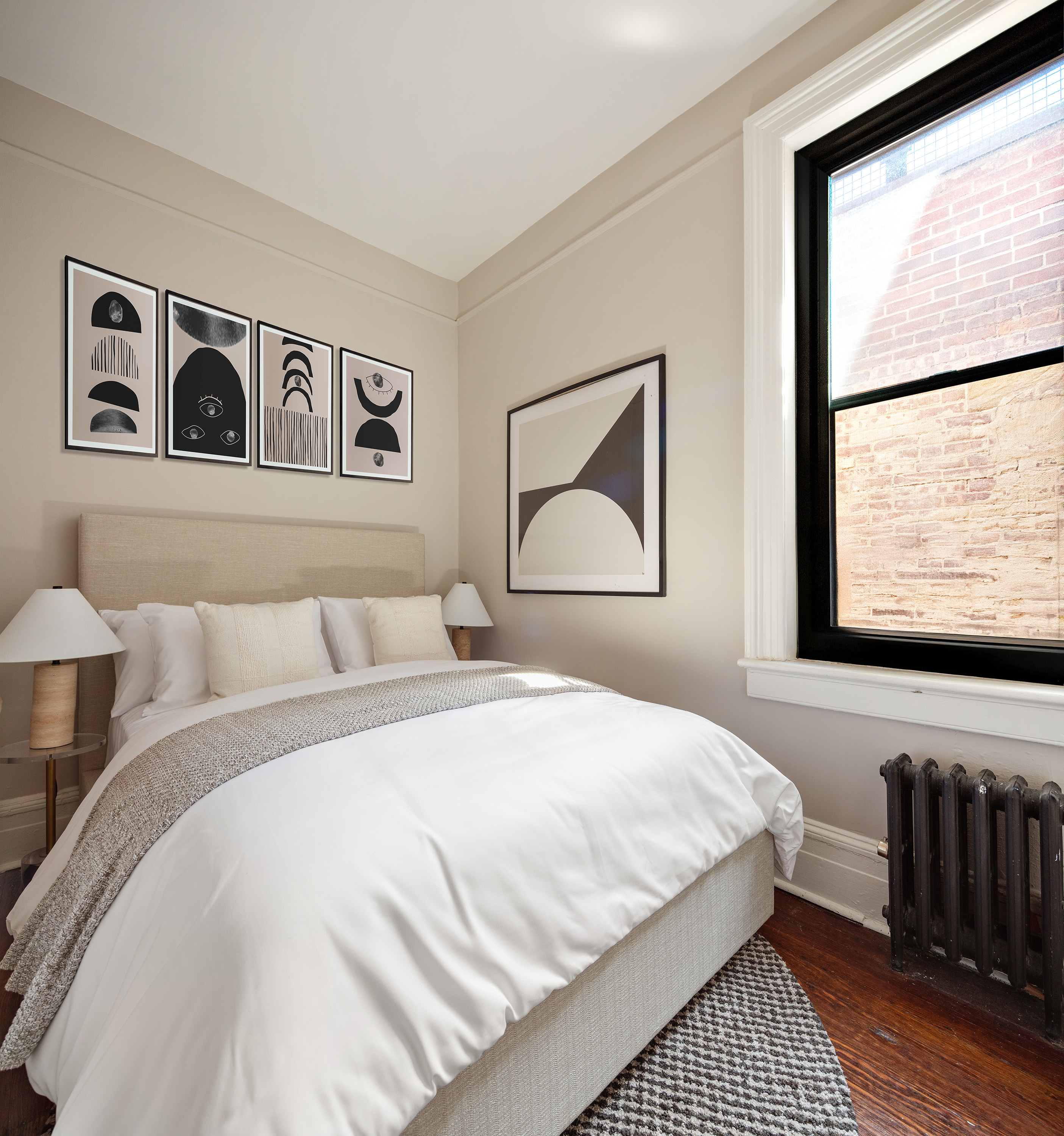 223 West 21st Street, Unit PH5M Manhattan, NY 10011 - Photo 6 of 12 a bedroom with a bed and a painting on the wall