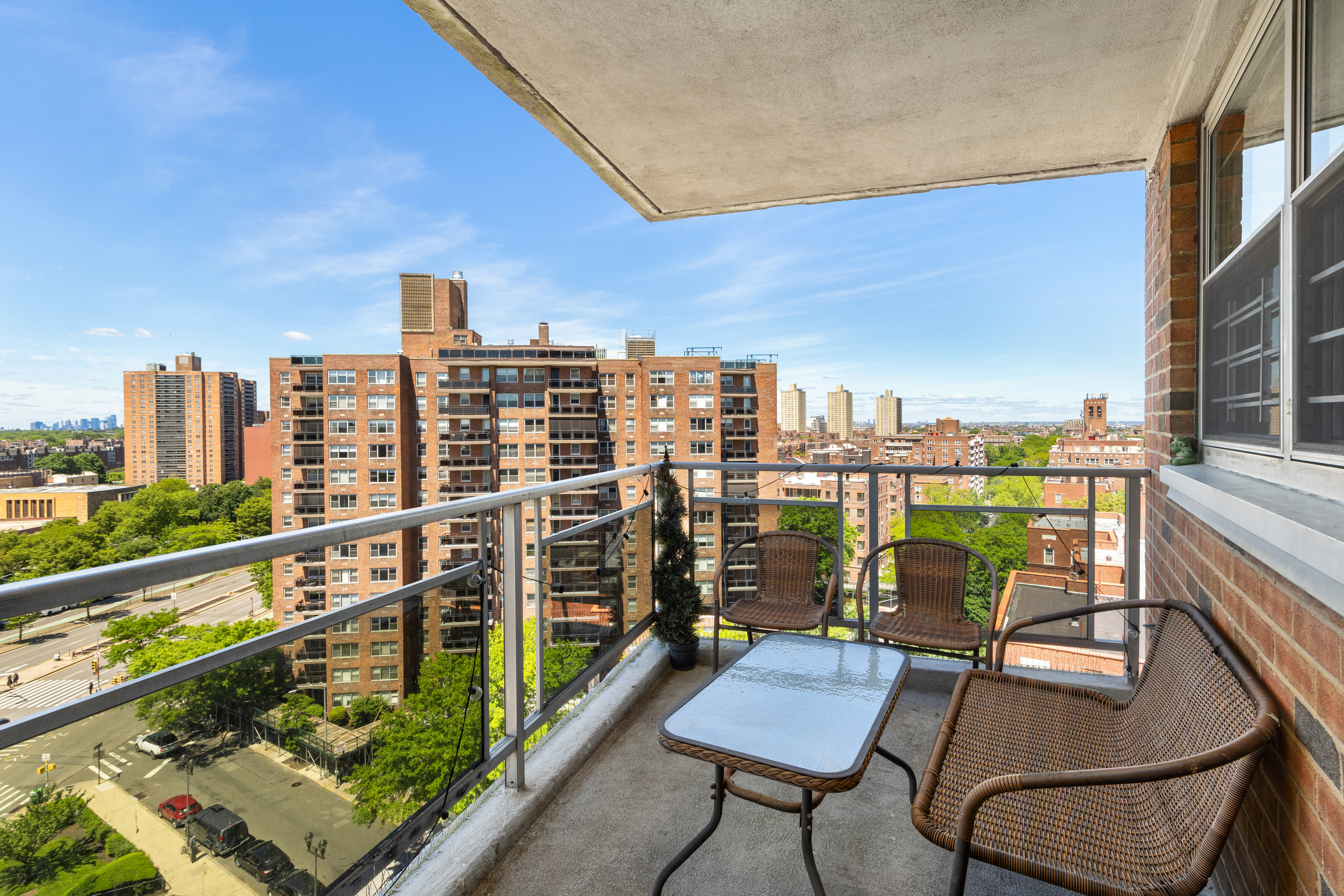 70-31 108th Street, Unit 12D Queens, NY 11375 - Photo 8 of 16 a view of a balcony with two chairs and a table