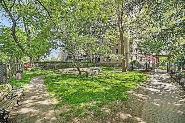 a view of a swimming pool with a patio and a yard