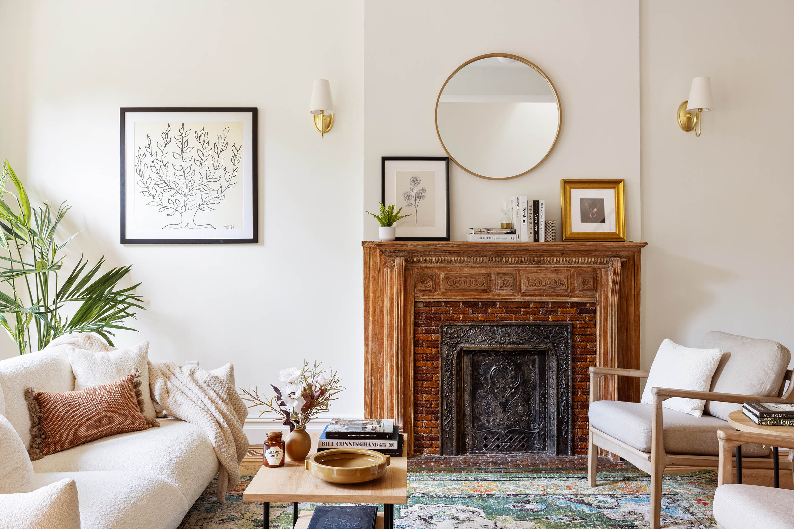 647 Macon Street Brooklyn, NY 11233 - Photo 3 of 20 a living room with furniture a mirror and a fireplace