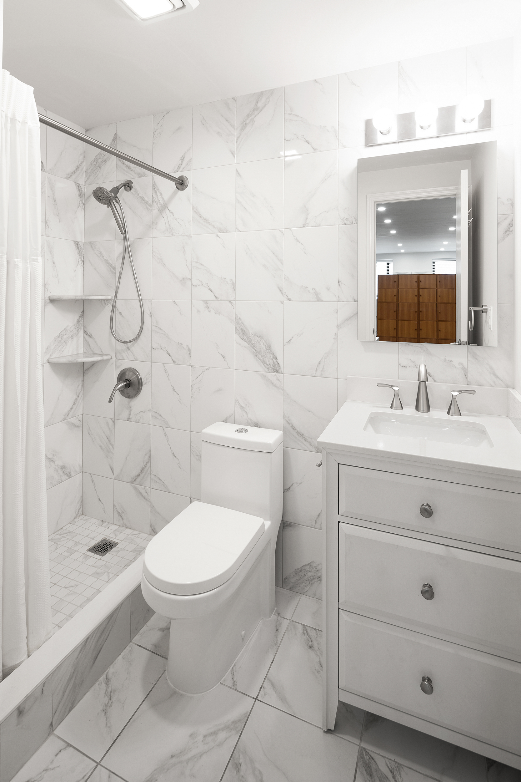 101 Allen Street, Unit 3A Manhattan, NY 10002 - Photo 5 of 5 a bathroom with a toilet sink and shower