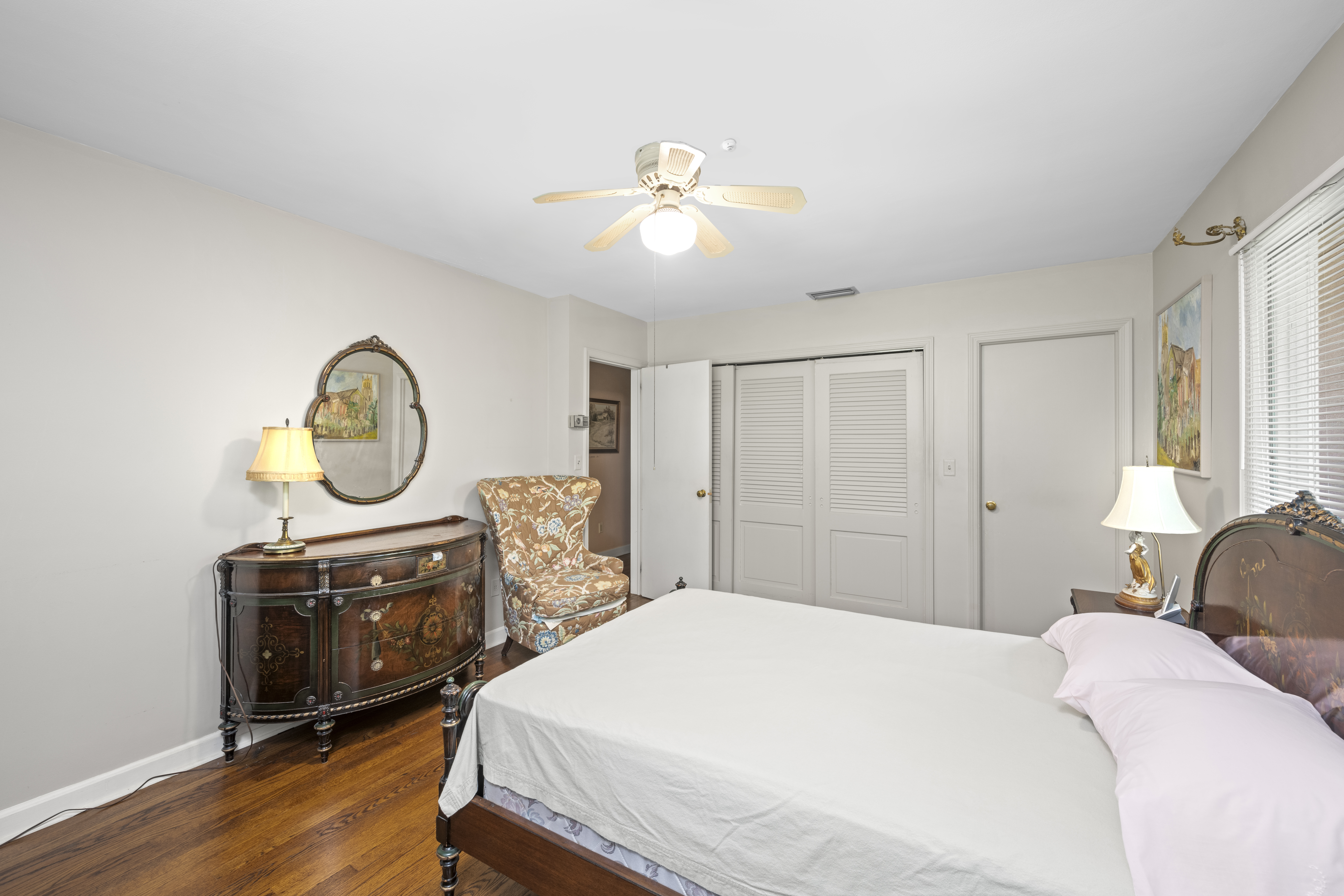420 Ocean Terrace Staten Island, NY 10301 - Photo 20 of 28 a bedroom with a bed and a chandelier