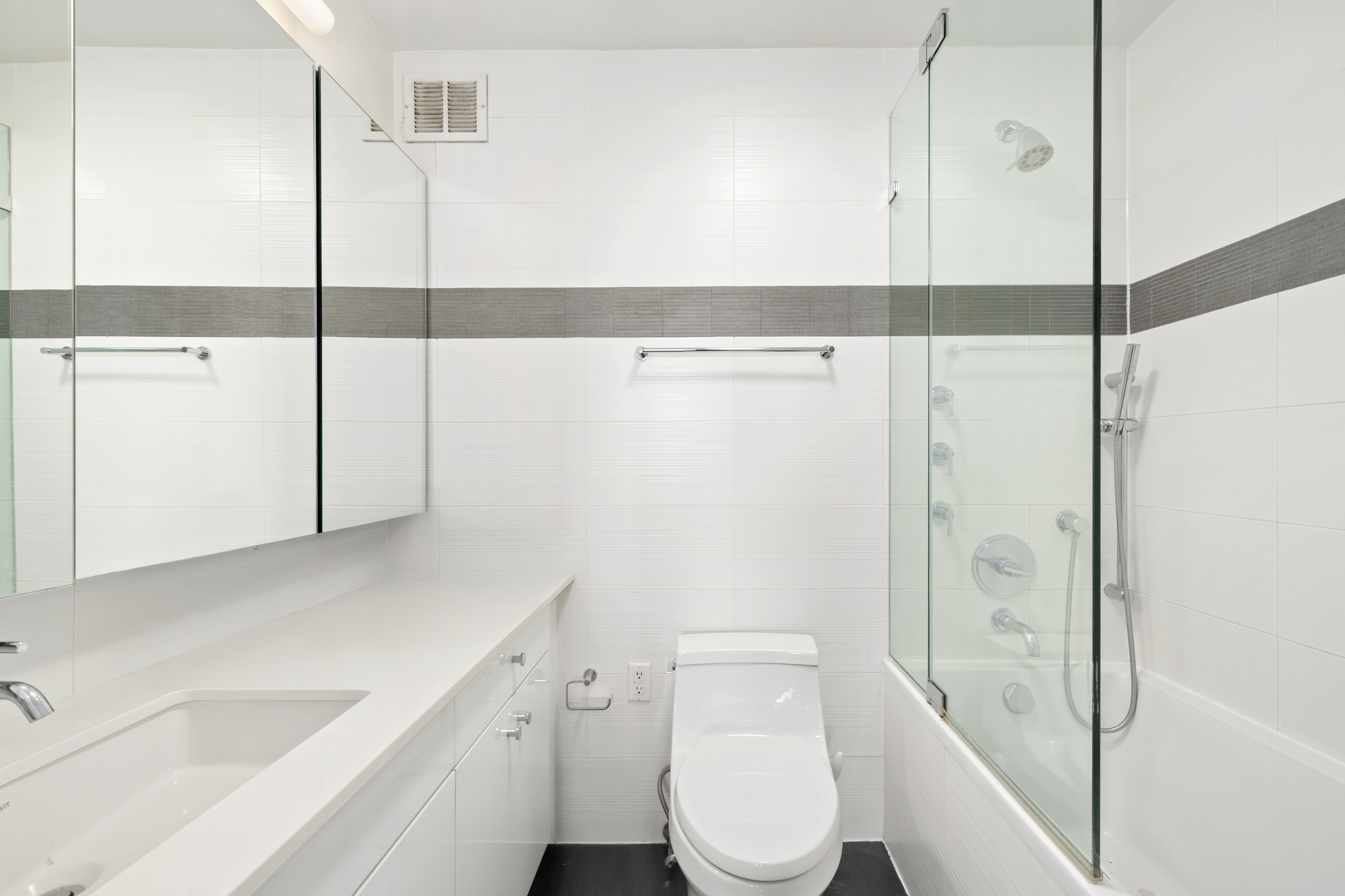 330 East 38th Street, Unit PHB Manhattan, NY 10016 - Photo 8 of 11 a bathroom with a sink a toilet and shower