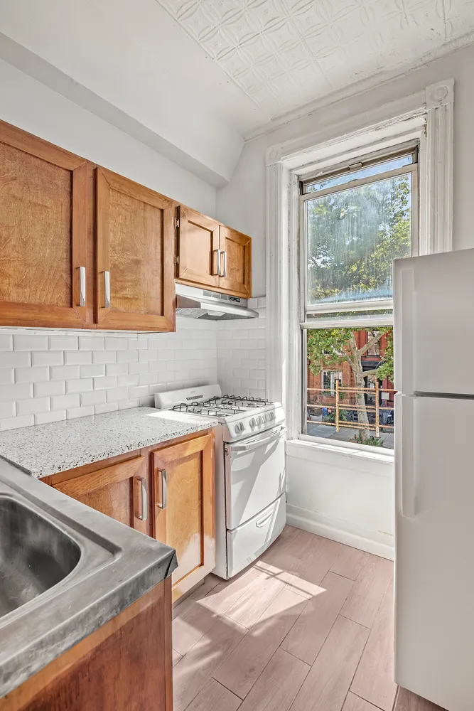 a kitchen that has a sink and a stove