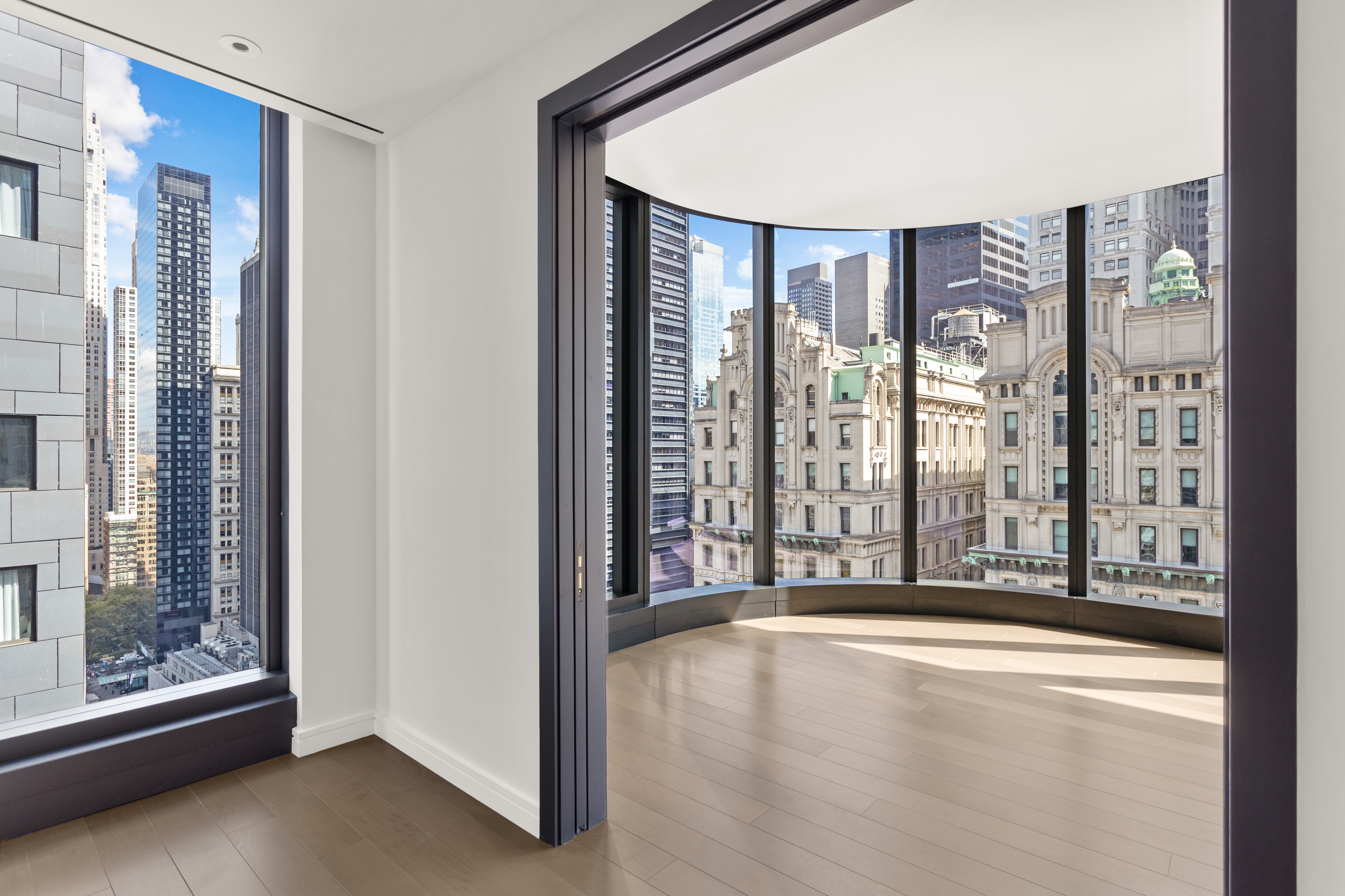 125 Greenwich Street, Unit 31A Manhattan, NY 10006 - Photo 14 of 23 a view of an entryway with wooden floor and door