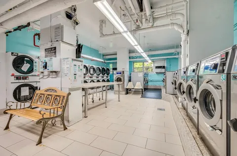 a view of a kitchen with furniture and a chandelier