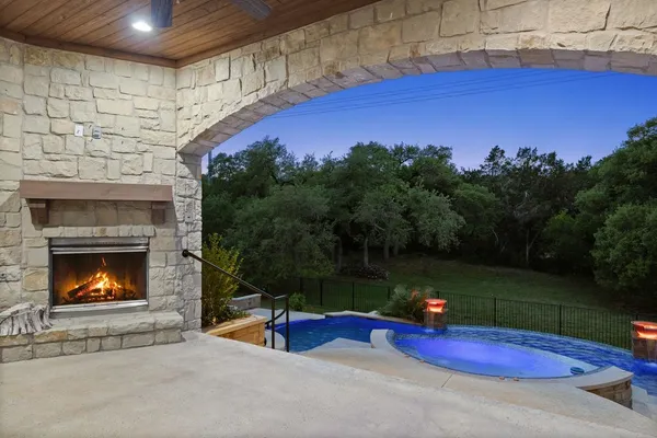 an aerial view of a house with outdoor space pool seating area and yard