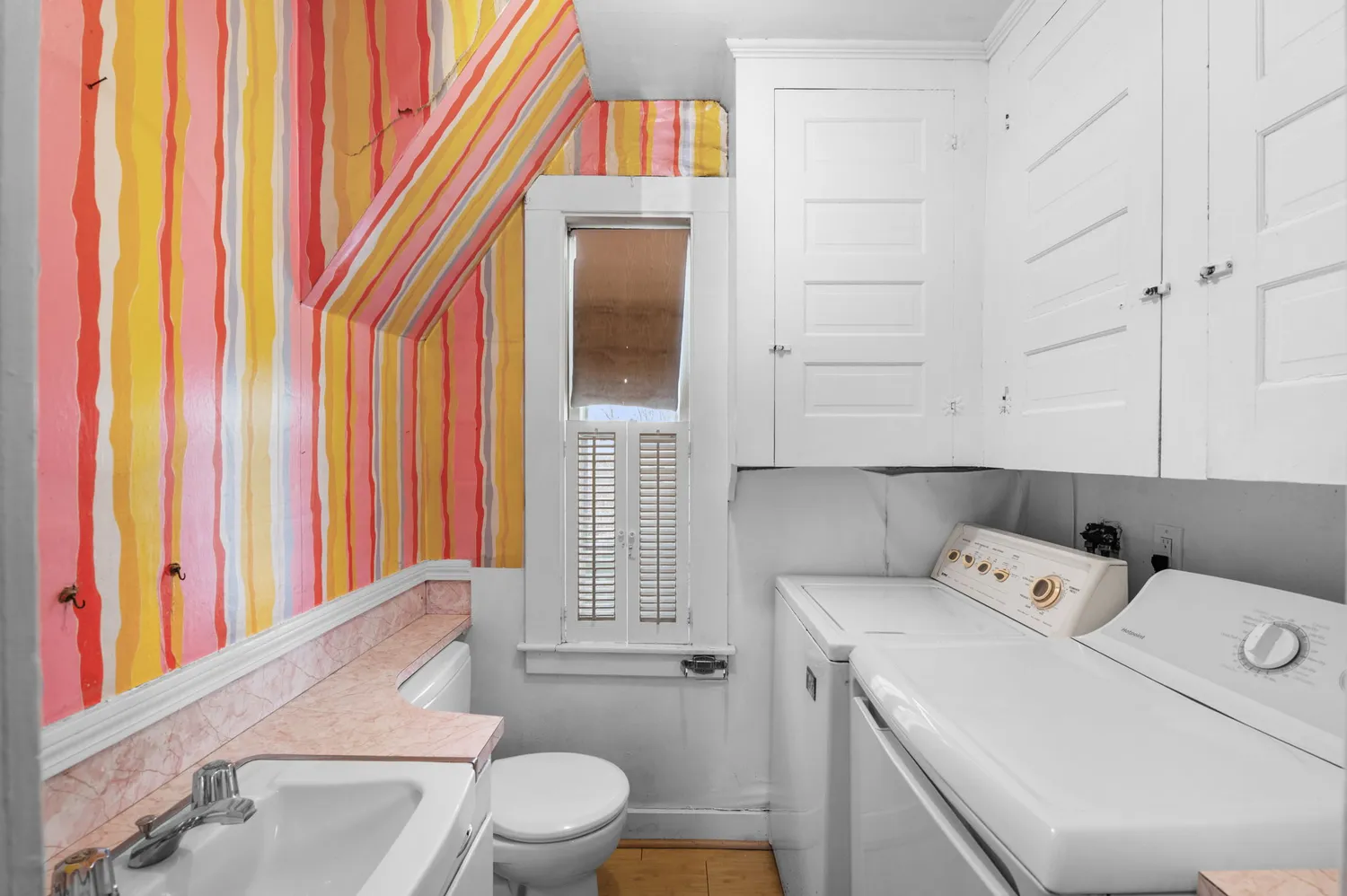 a kitchen with stainless steel appliances granite countertop a refrigerator a stove and a sink with wooden floor