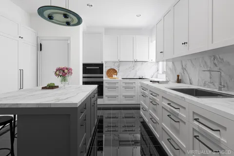 a kitchen with stainless steel appliances granite countertop a sink and cabinets