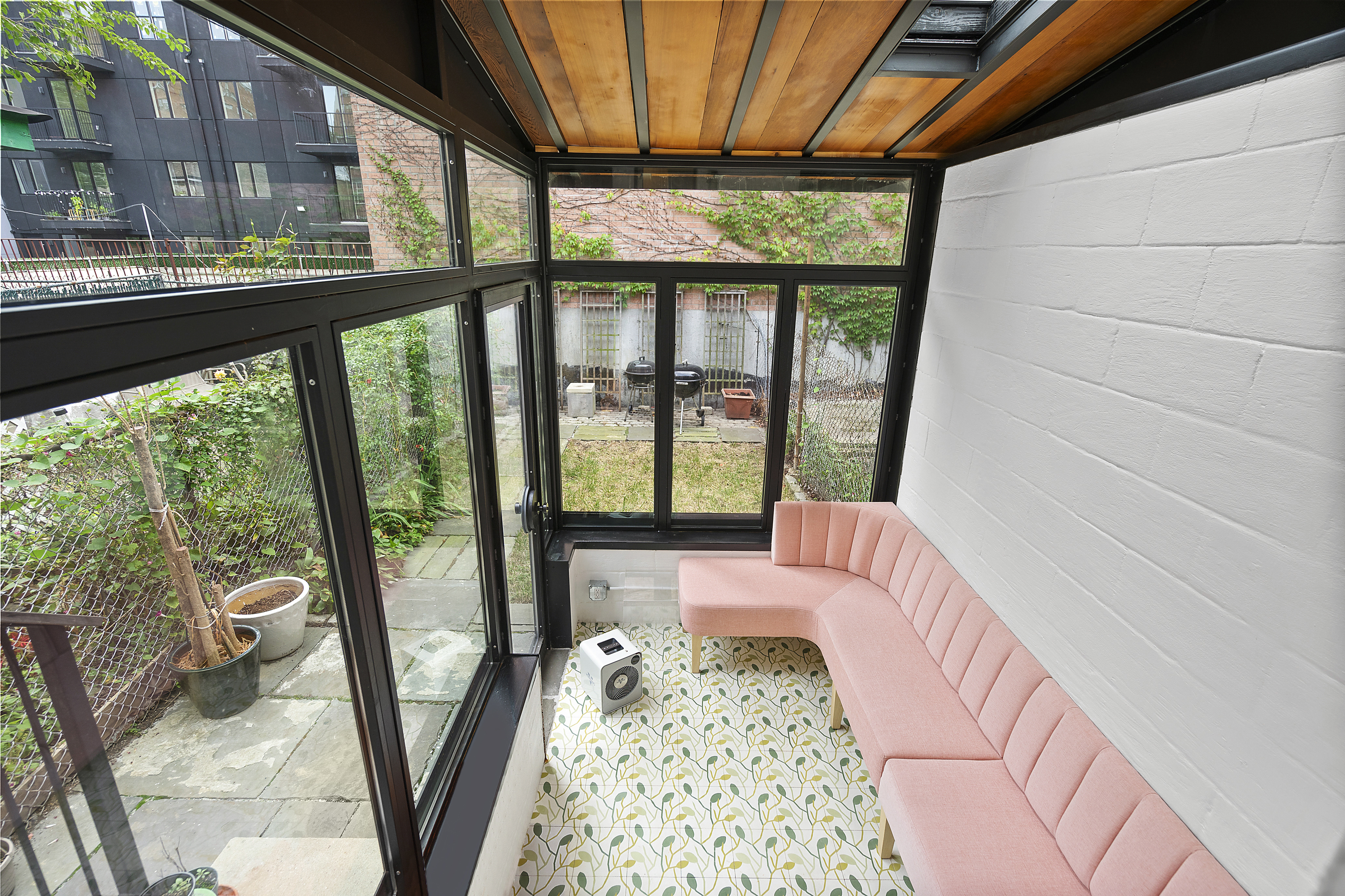 394 Lafayette Avenue, Unit 2 Brooklyn, NY 11238 - Photo 4 of 13 a bedroom with large windows and a table