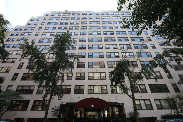 420 East 51st Street, Unit 10H Manhattan, NY 10022 - Photo 13 of 14 a front view of a building with balcony