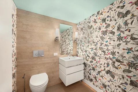 a bathroom with a bathtub and a double vanity sink