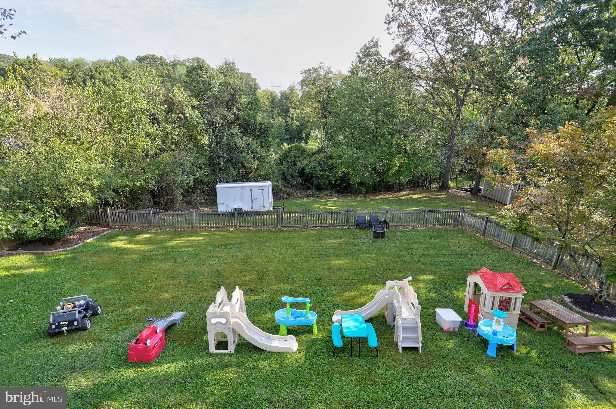 6257 Fairbourne Court Hanover, MD 21076 - Photo 44 of 47 a backyard view with sitting space and garden