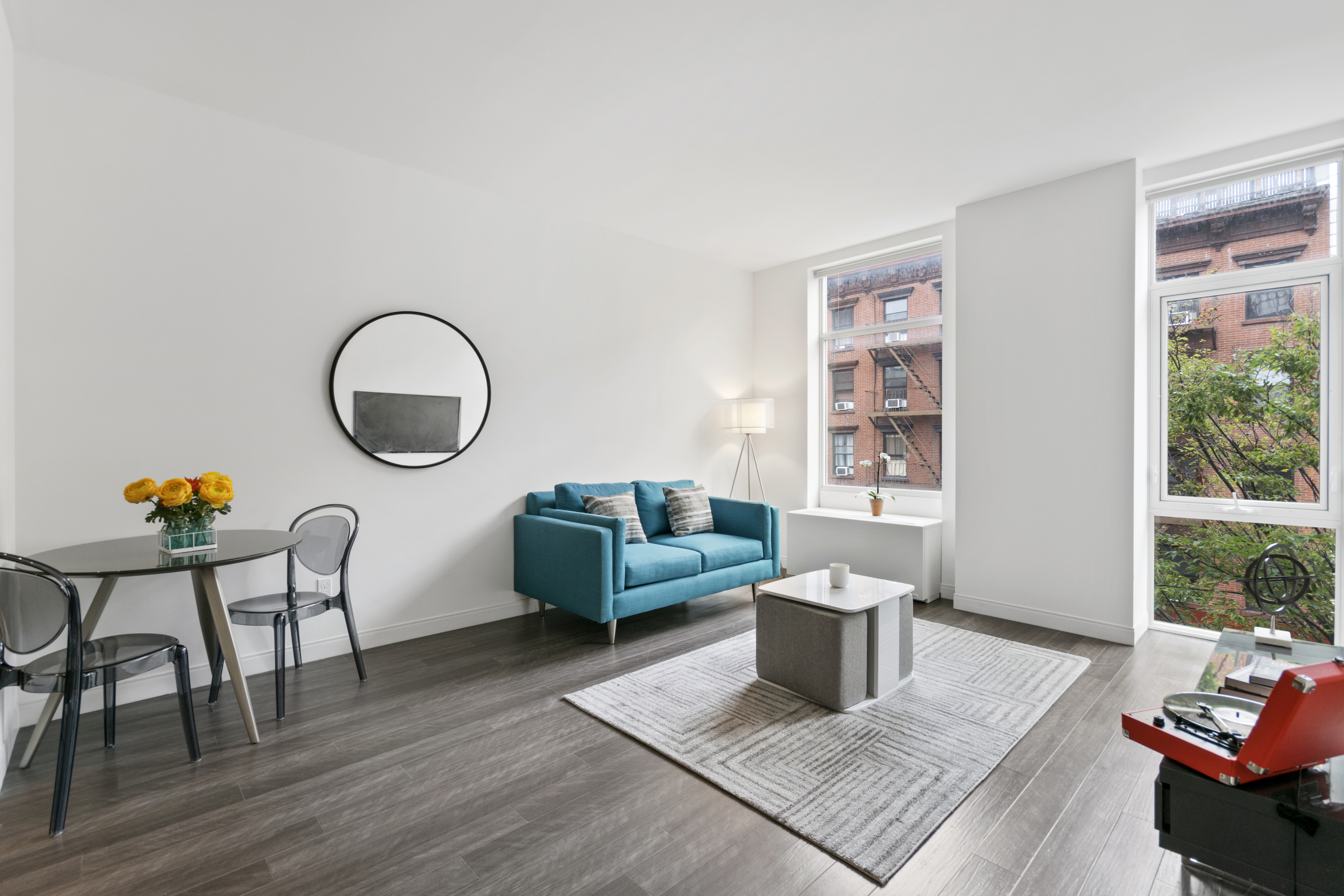 a living room with furniture and a large window