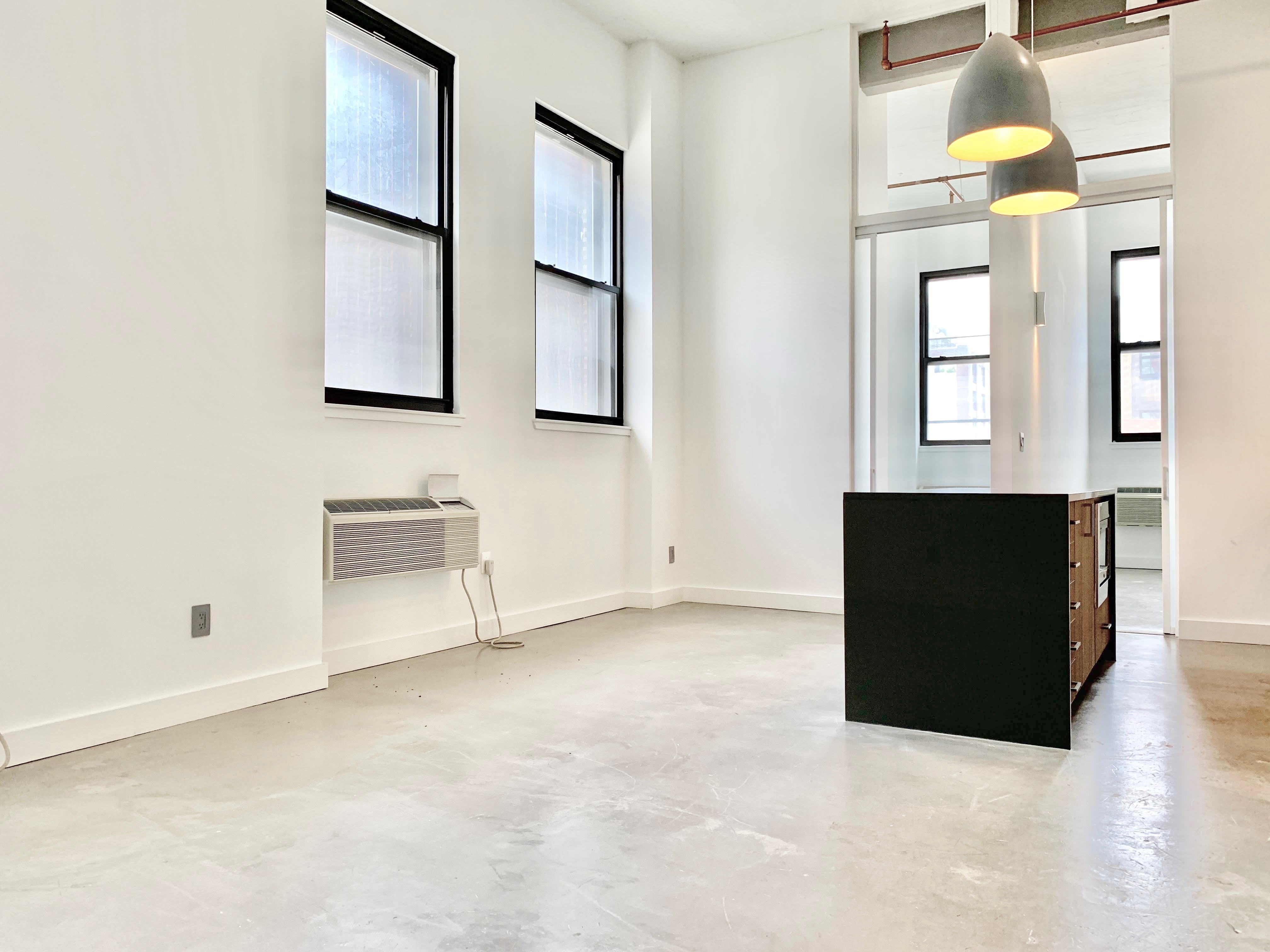 44 Berry Street, Unit 2C Brooklyn, NY 11249 - Photo 3 of 8 an entryway with a cabinet and mirror