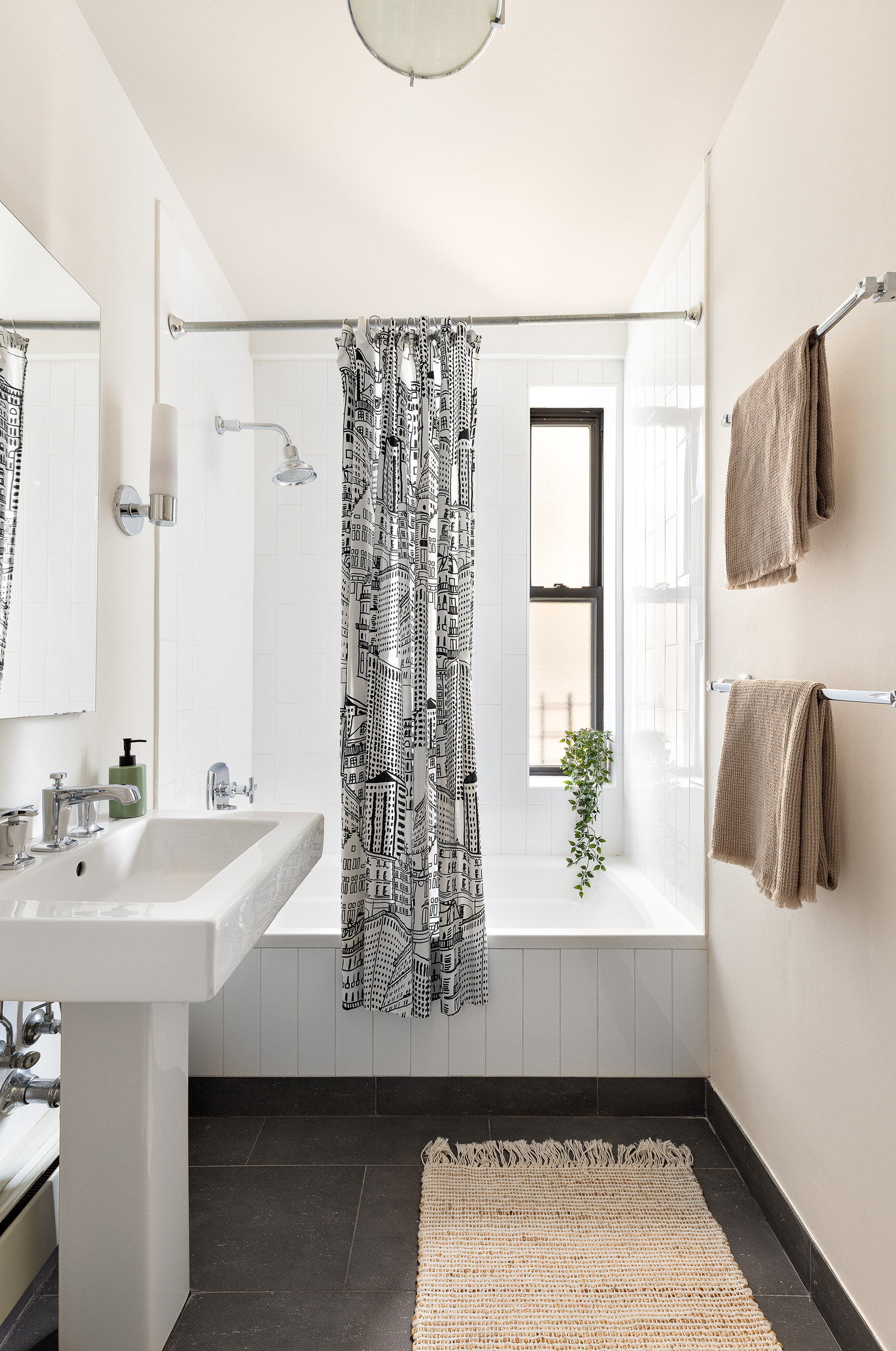 135 Eastern Parkway, Unit 7A Brooklyn, NY 11238 - Photo 10 of 15 a bathroom with a sink and a bathtub