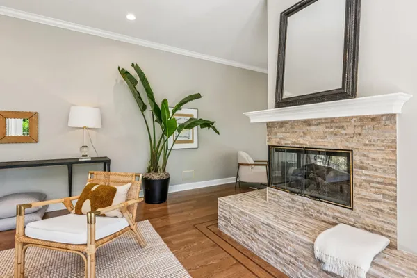 a bedroom with furniture and a fireplace