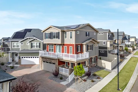 a terrace of a house with table and chairs