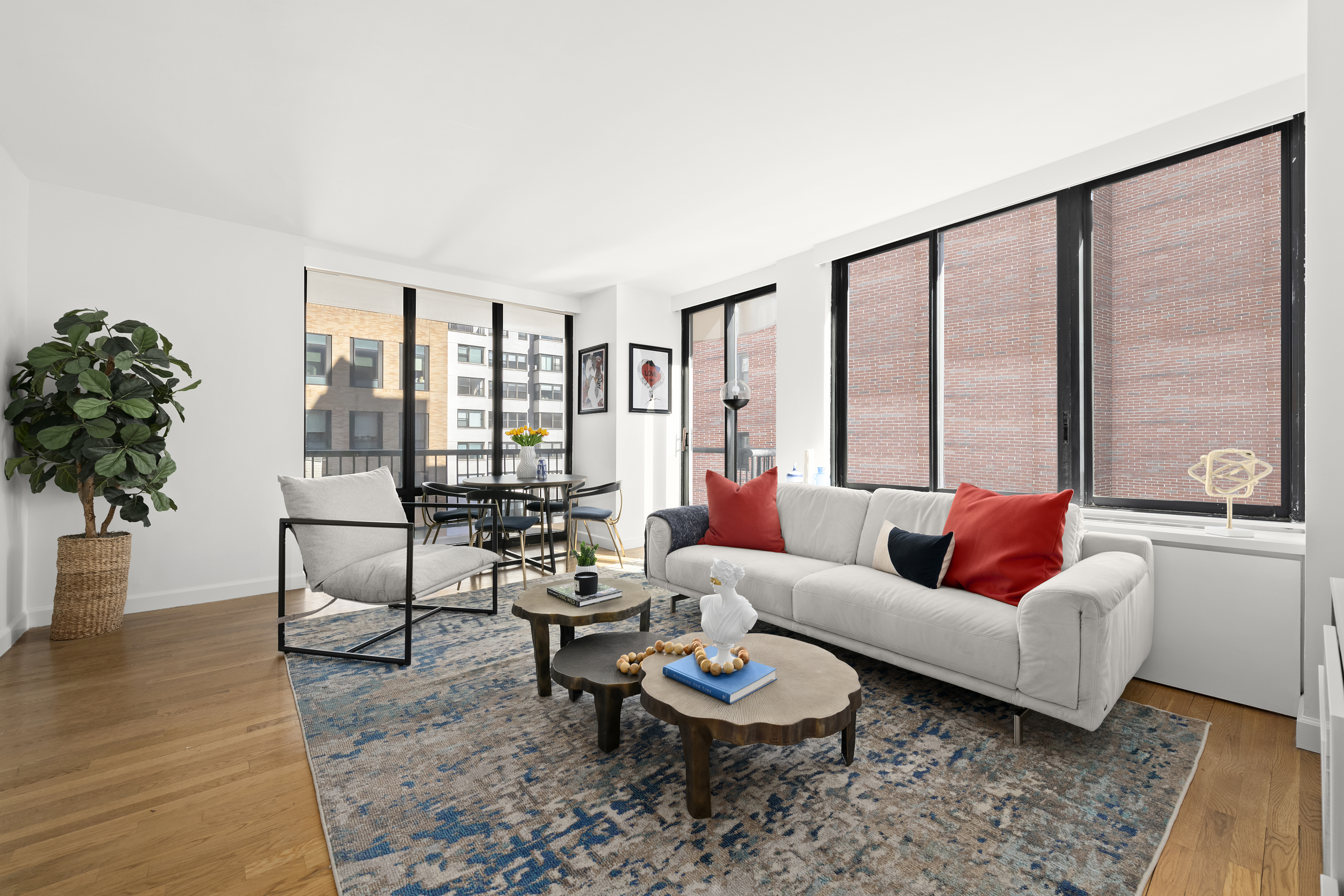 304 East 65th Street, Unit 6D Manhattan, NY 10065 - Photo 2 of 15 a living room with furniture and a large window