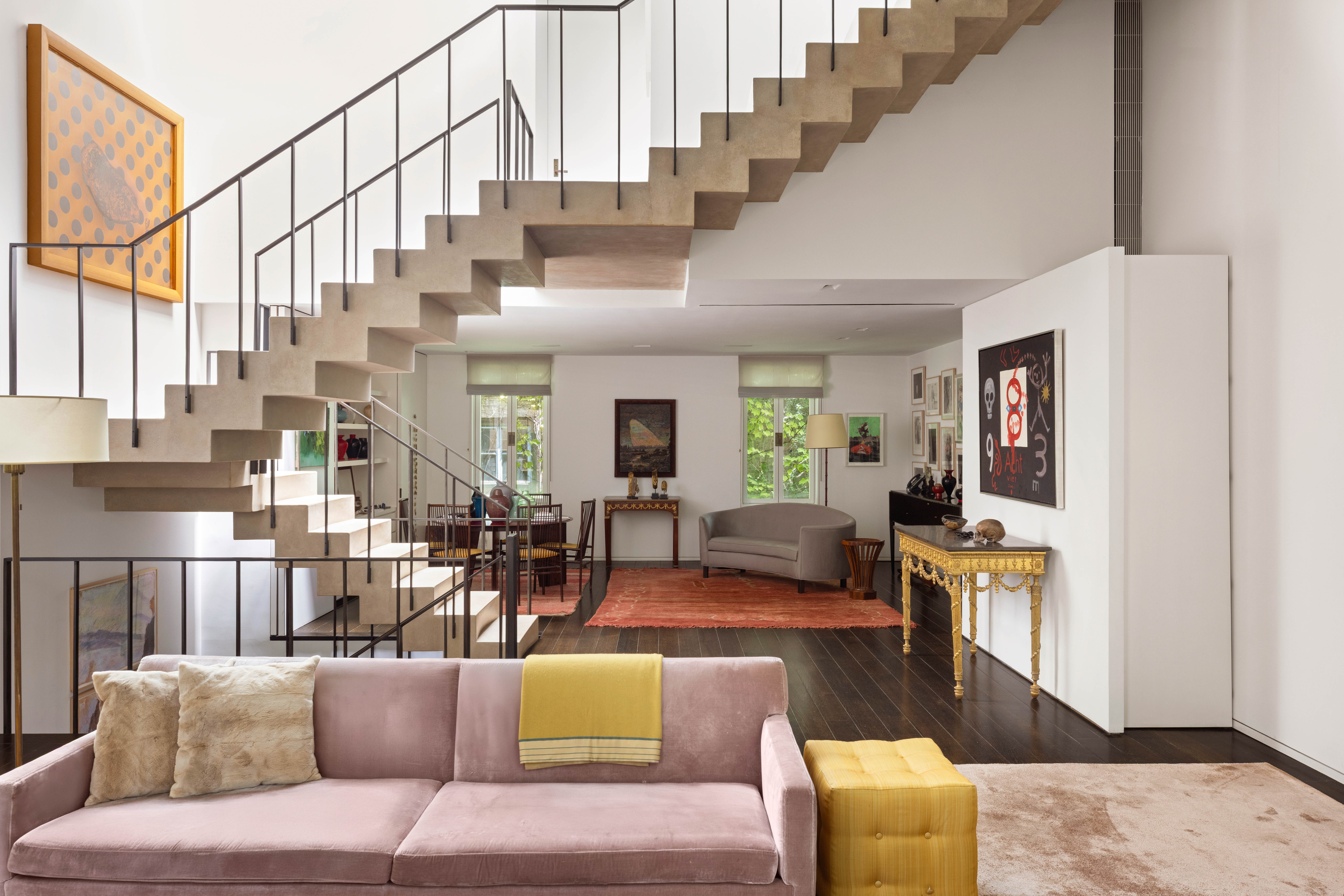 a living room with furniture or couch and a dining table