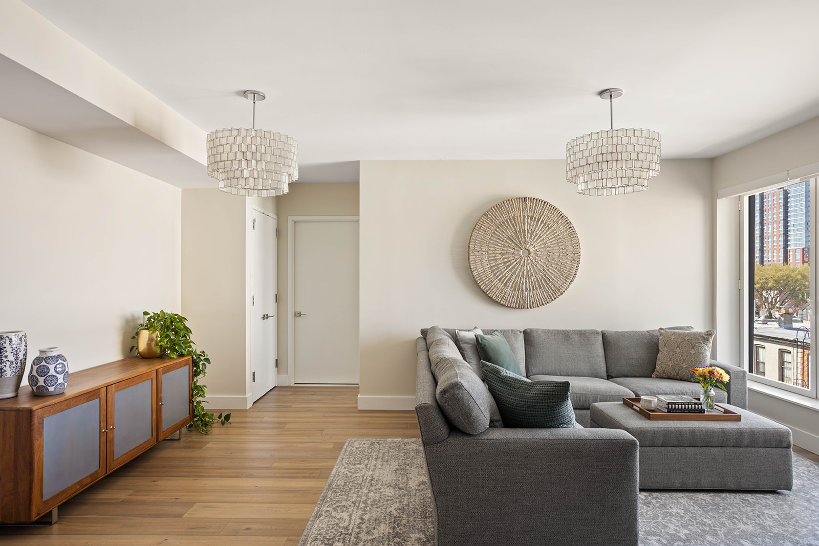 561 Pacific Street, Unit 606 Brooklyn, NY 11217 - Photo 6 of 17 a living room with furniture chandelier and a window