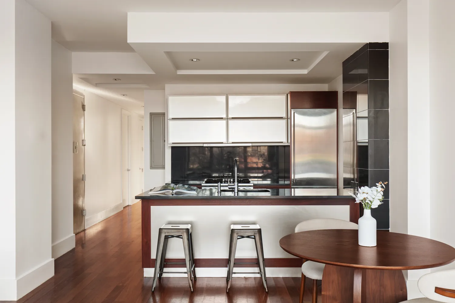 a kitchen with a table and chairs
