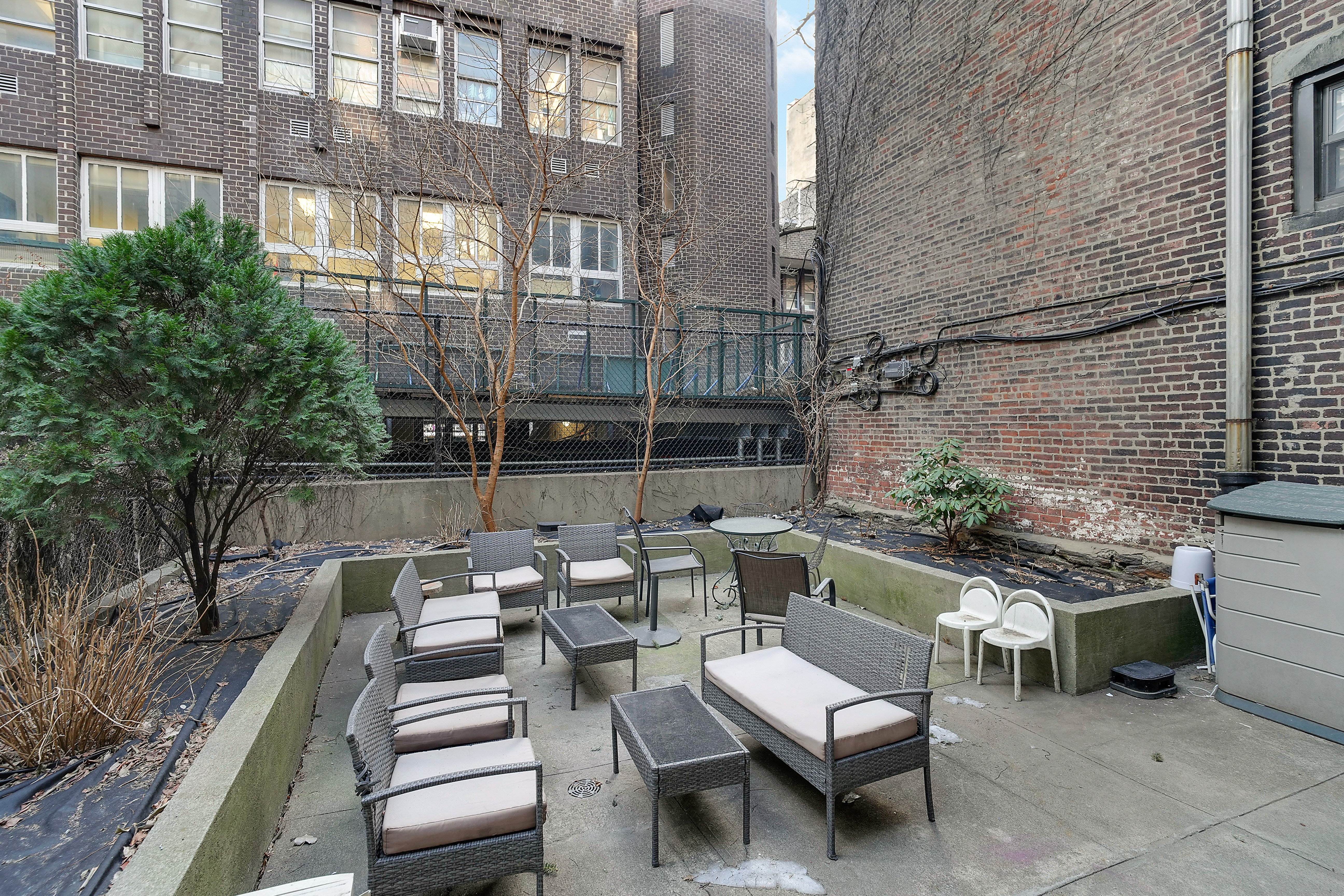 240 East 24th Street, Unit 4G Manhattan, NY 10010 - Photo 6 of 10 a view of a patio with couches table and chairs and potted plants