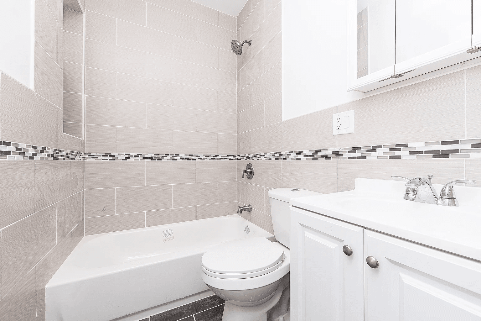 581 Van Siclen Avenue Brooklyn, NY 11207 - Photo 11 of 16 a bathroom with a sink a toilet and bathtub