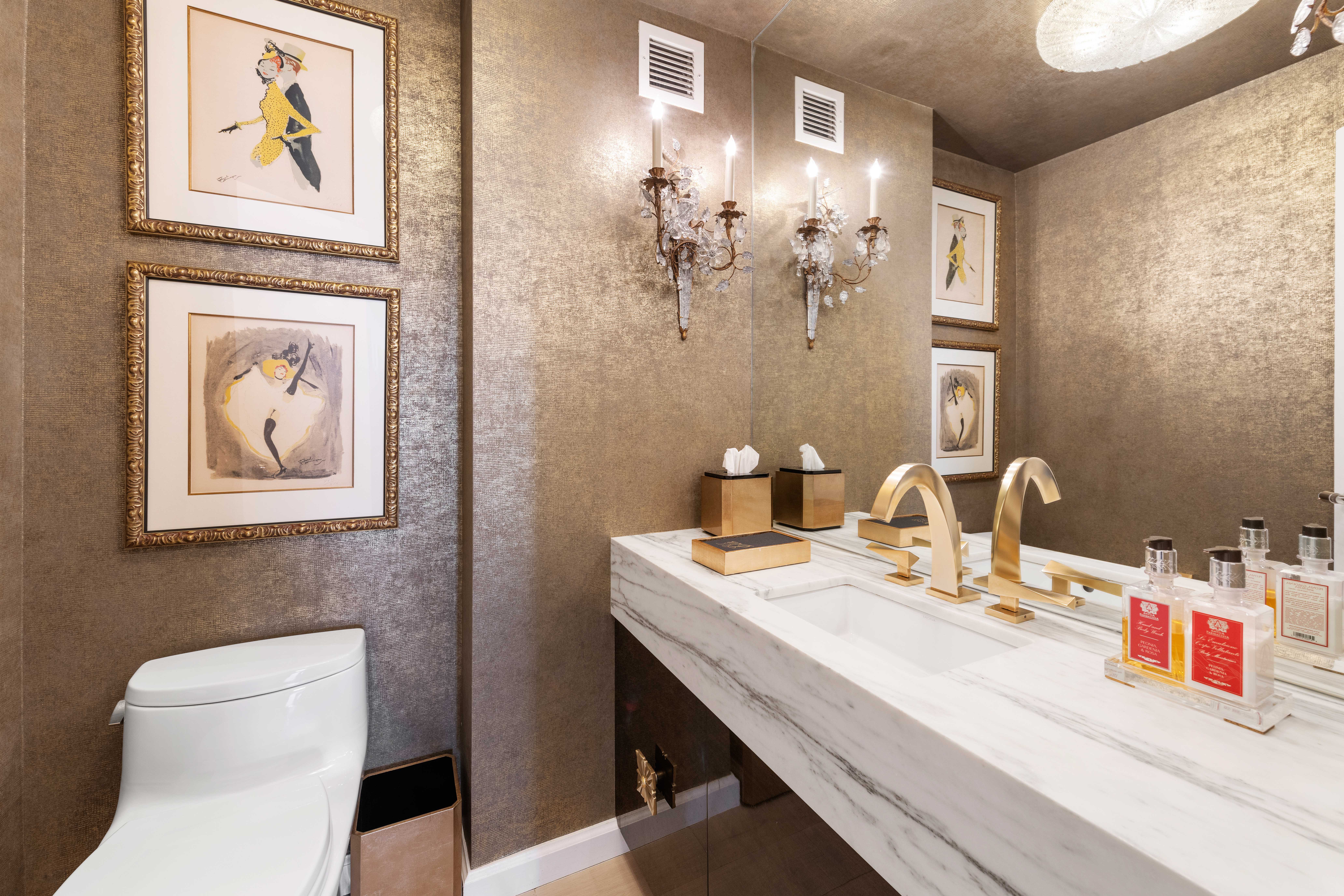 200 East 62nd Street, Unit 5A Manhattan, NY 10065 - Photo 13 of 25 a bathroom with a toilet sink and mirror