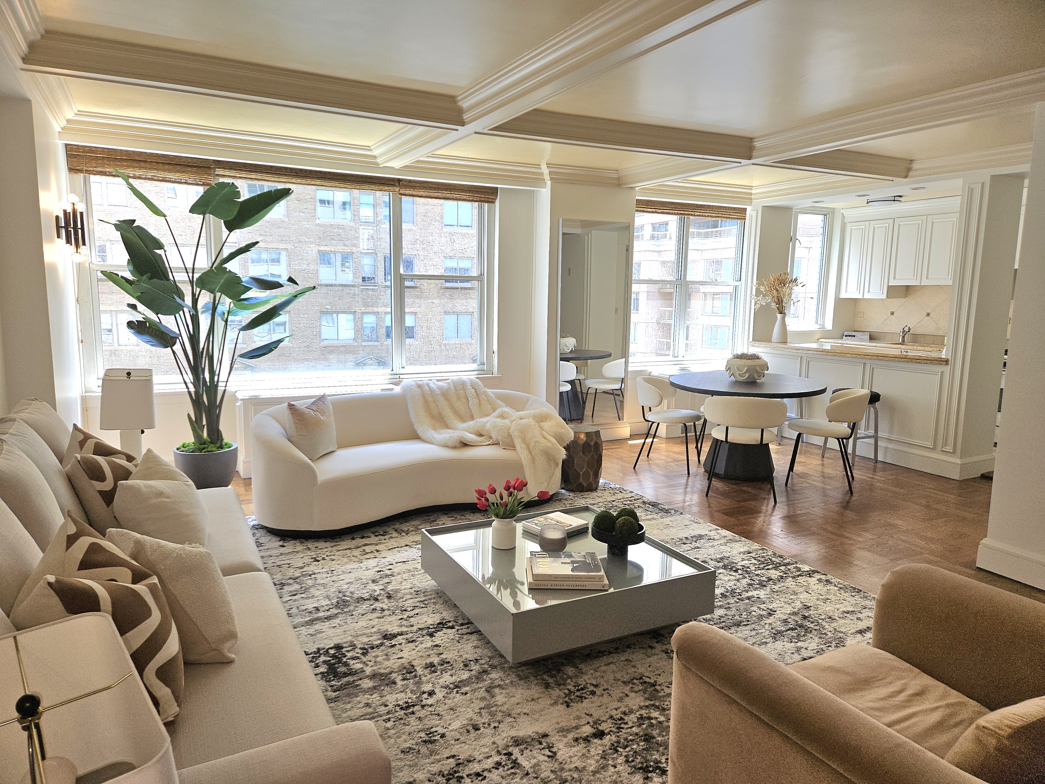 169 East 69th Street, Unit 7/8 B Manhattan, NY 10021 - Photo 4 of 30 a living room with furniture and a large window