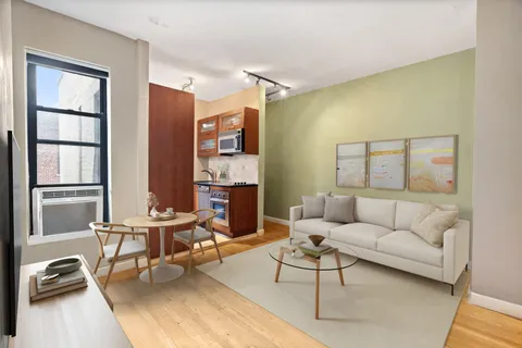 a living room with furniture and a window