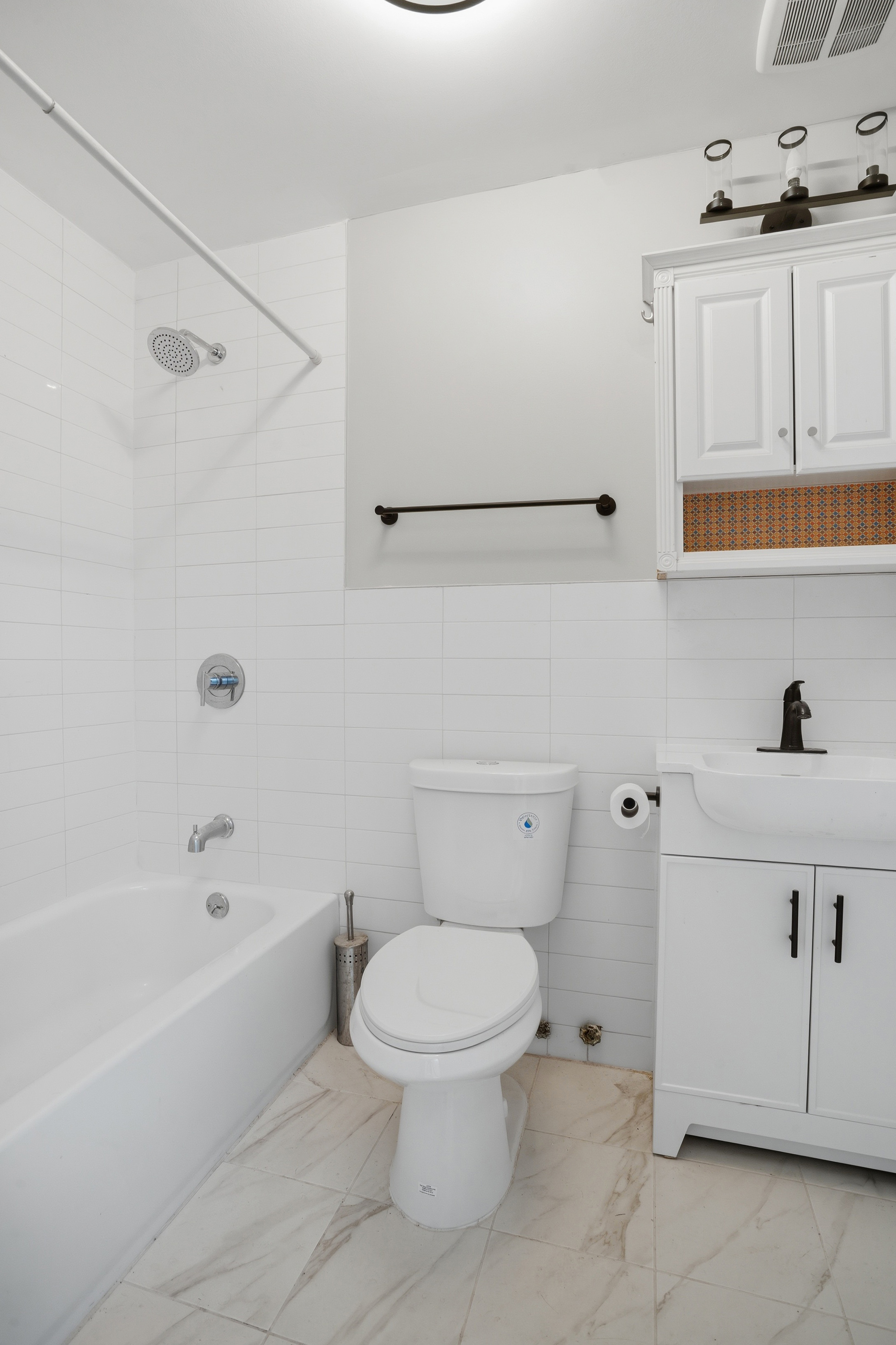 417 A 18th Street Brooklyn, NY 11215 - Photo 9 of 16 a white toilet sitting next to a bathroom sink