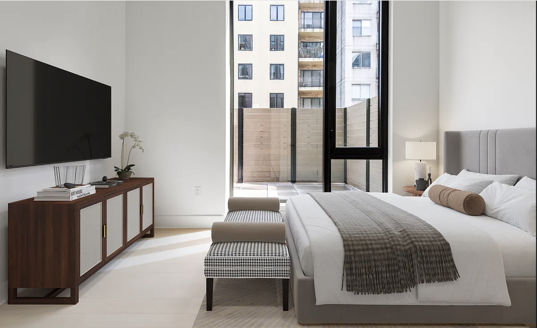 218 Front Street, Unit 184 Brooklyn, NY 11201 - Photo 6 of 13 a bedroom with a bed and a flat screen tv