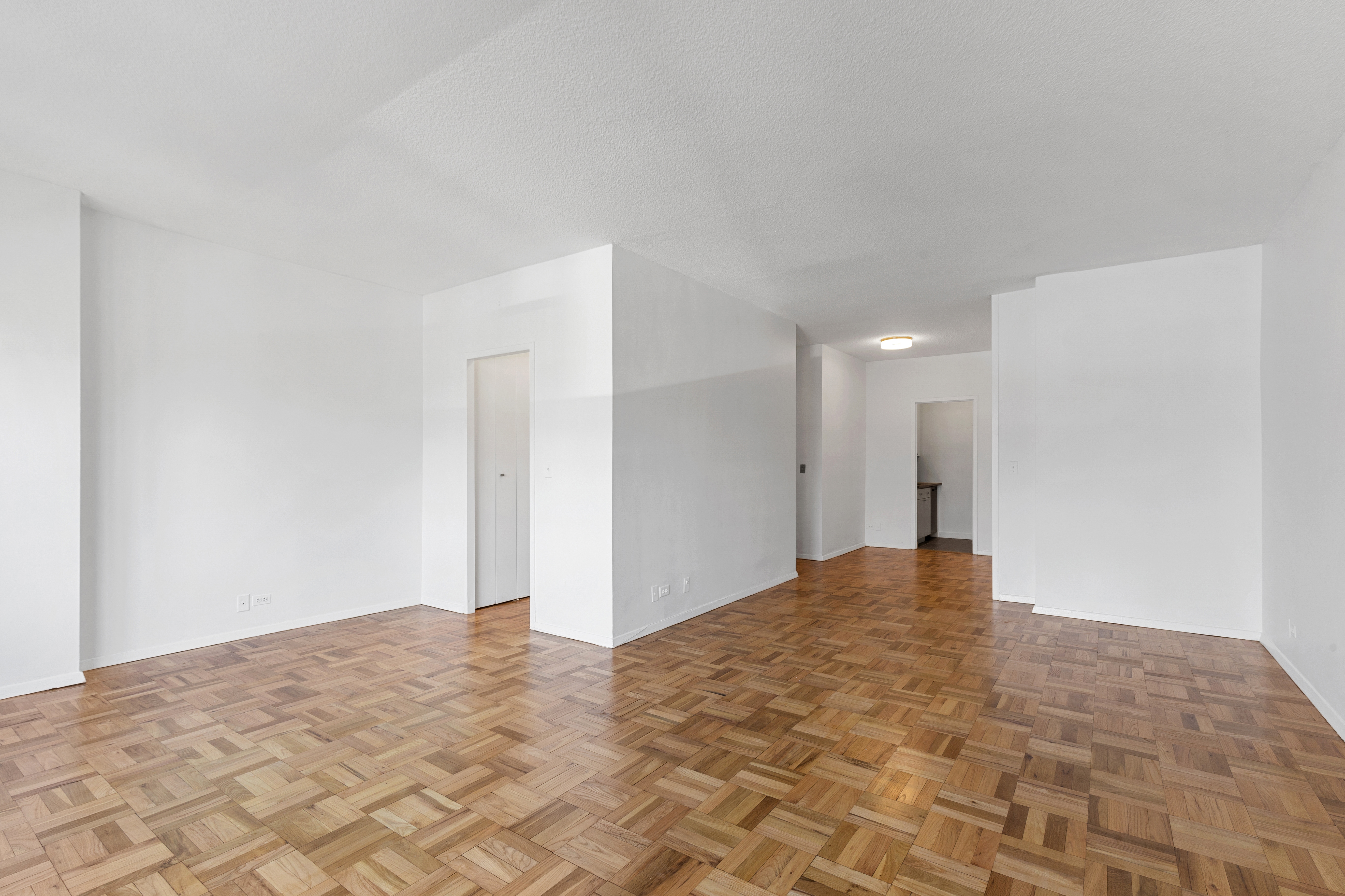 60 East 8th Street, Unit 9J Manhattan, NY 10003 - Photo 4 of 13 a view of an empty room