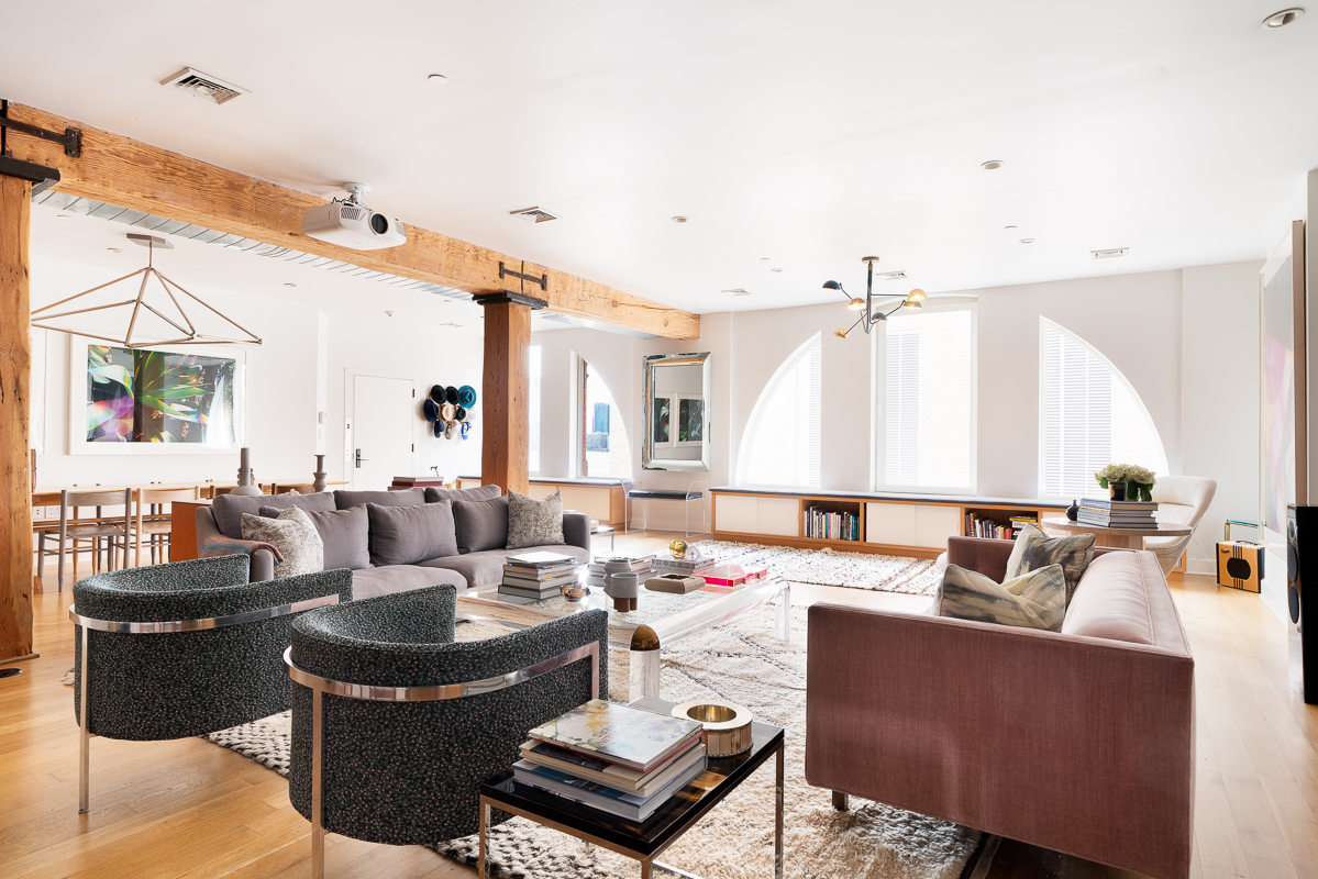 481 Washington Street, Unit 6N Manhattan, NY 10013 - Photo 3 of 10 a living room with furniture and a large window
